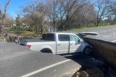Giant sinkhole in California swallows vehicle after driver ignores road closure signs