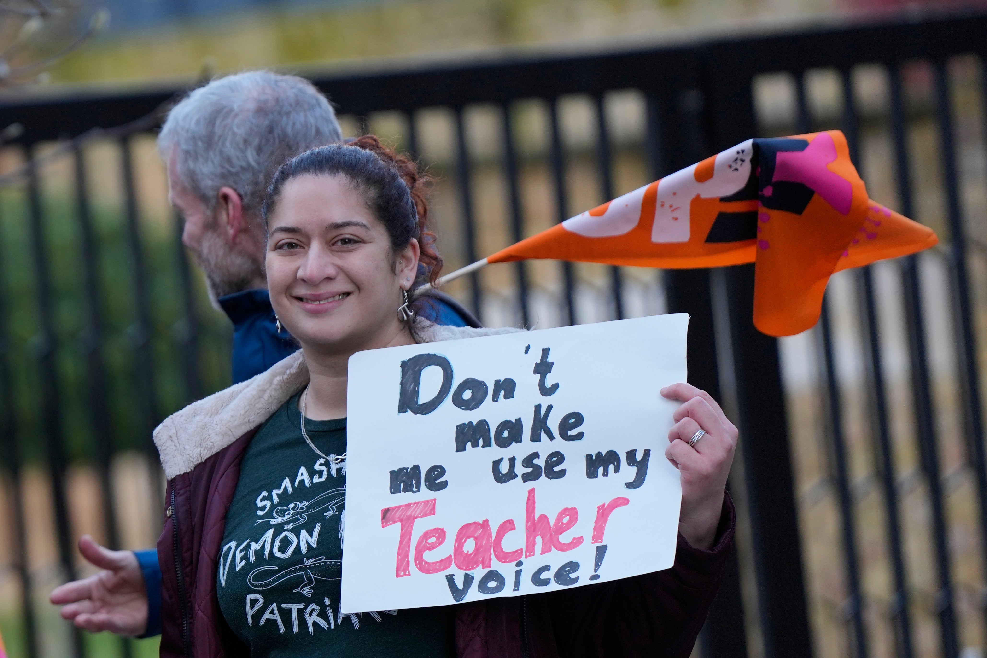 Teachers hold flags and placards on a picketline outside Holland Park School as they go on strike over pay in London