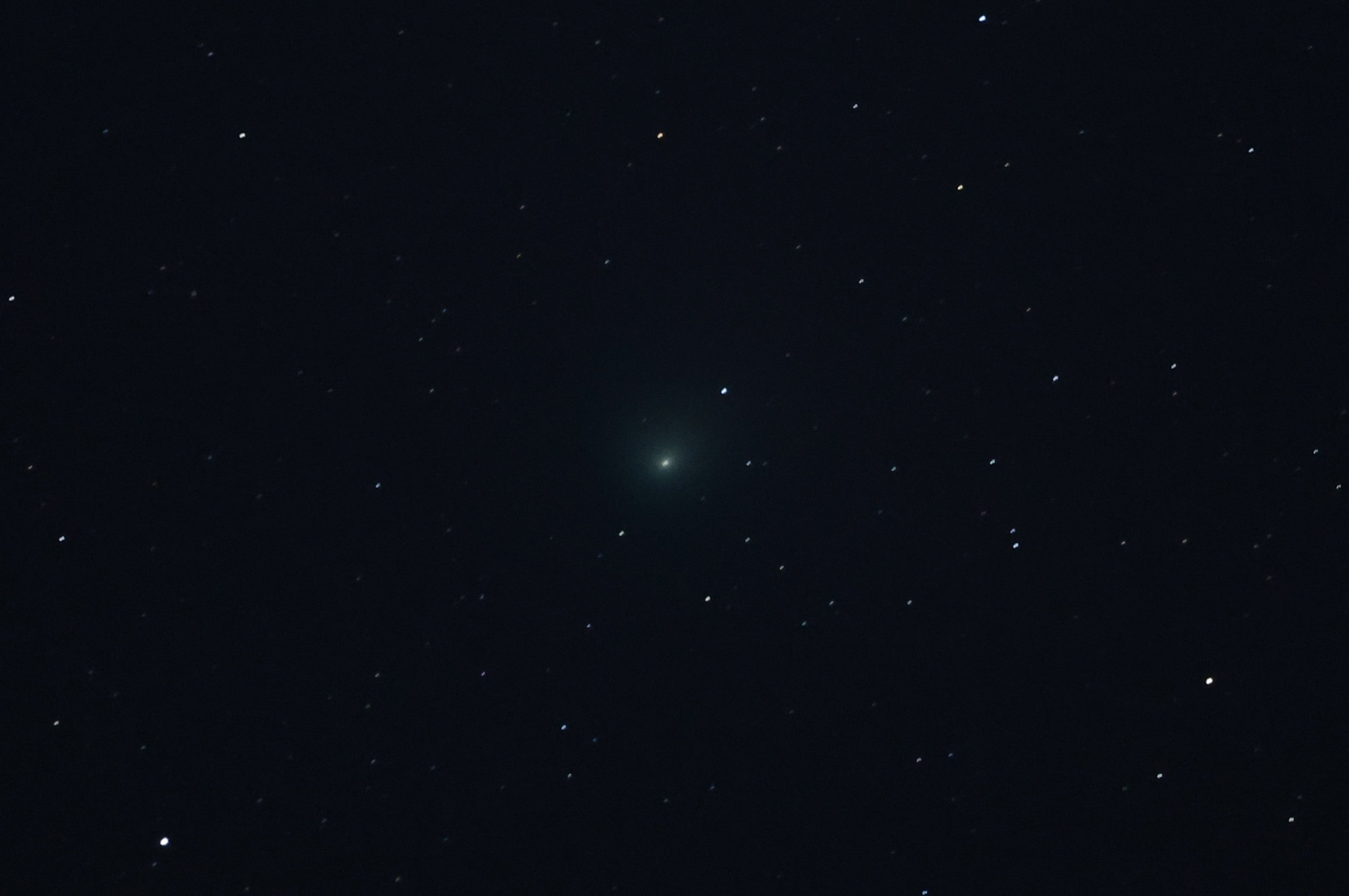 Comet C/2022 E3 (ZTF) is visible in the sky above the Mojave National Preserve in San Bernadino County as it approaches Earth for the first time in about 50,000 years on January 31, 2023 near Baker, California. The comet was discovered on March 2, 2022, and will be at its closest point to Earth on February 1, 2023. Its orbit extends far out into our solar system and has a green aura because it is passing close enough to the sun for the outgassing of its diatomic carbon molecules to react with the solar wind.