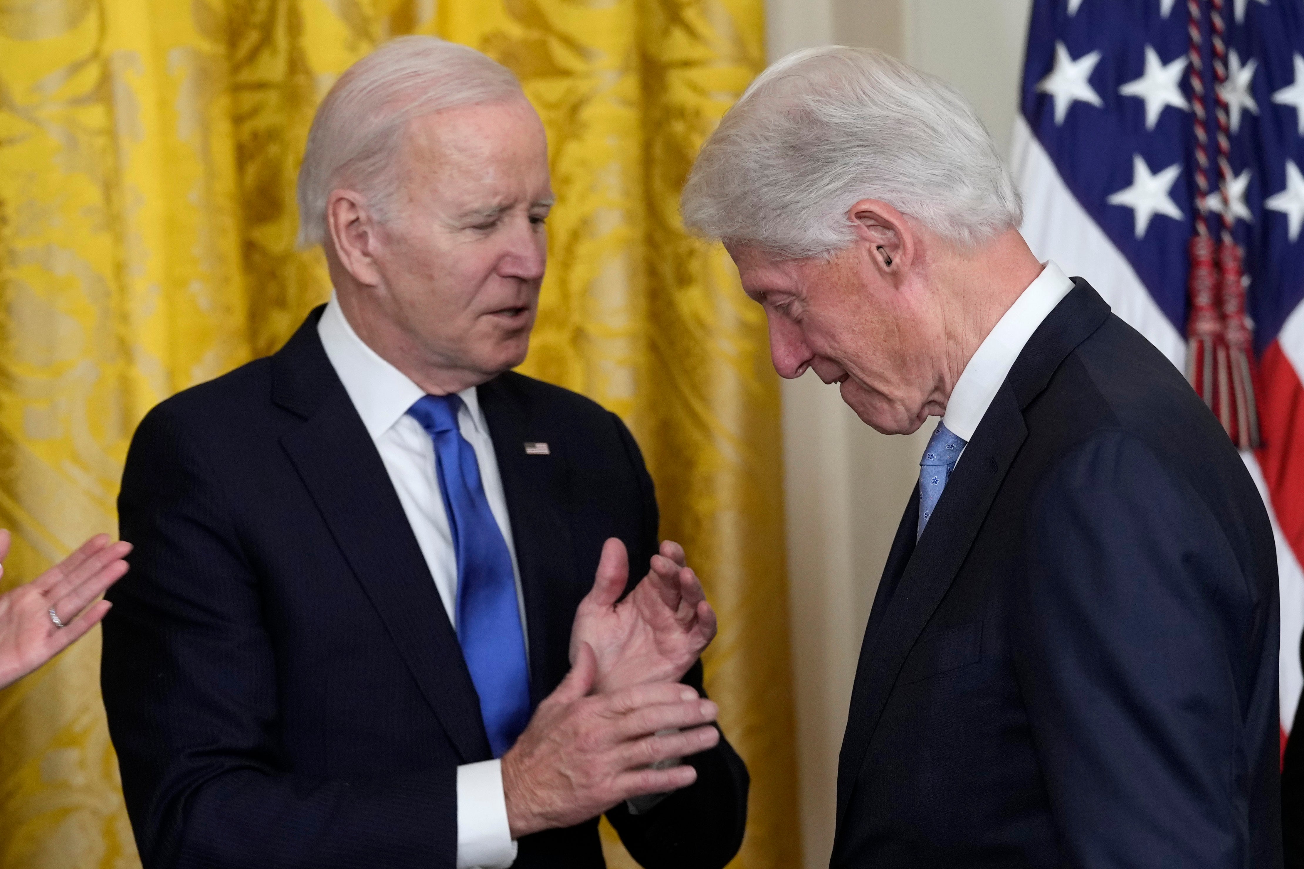 President Joe Biden talks with former President Bill Clinton during an event in the East Room of the White House in Washington, Thursday, Feb. 2, 2023, to mark the 30thÂ Anniversary of the Family and Medical Leave Act. (AP Photo/Susan Walsh)