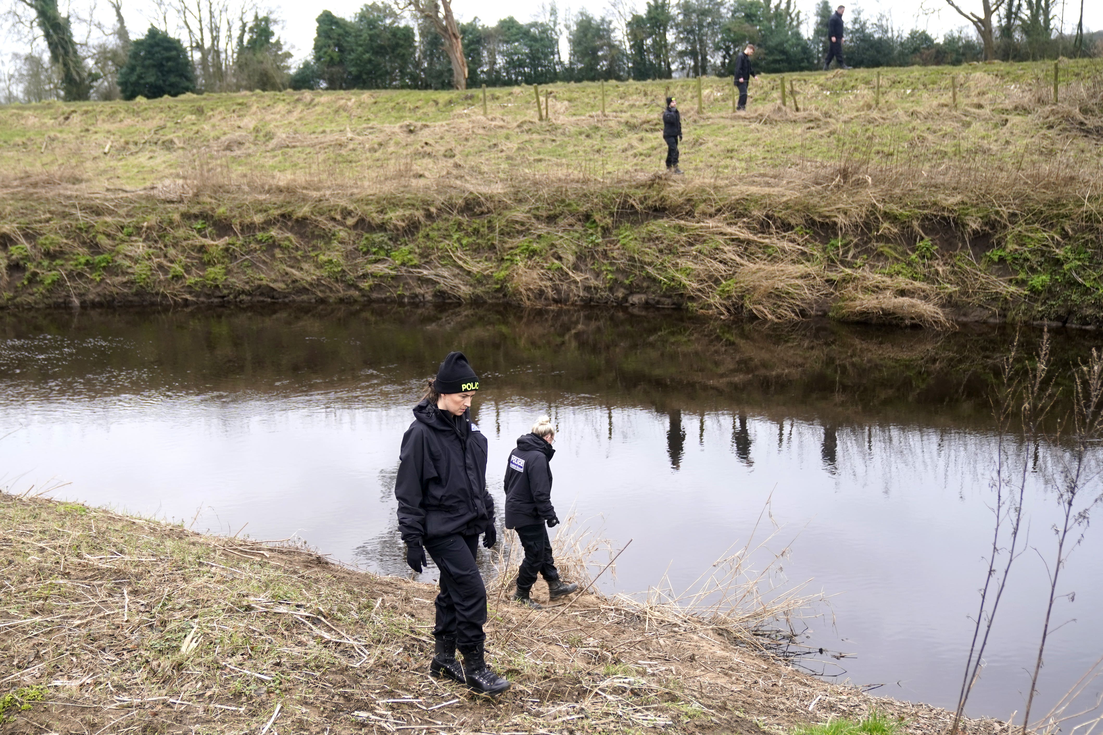 Police officers search near the River Wyre in St Michael’s on Wyre