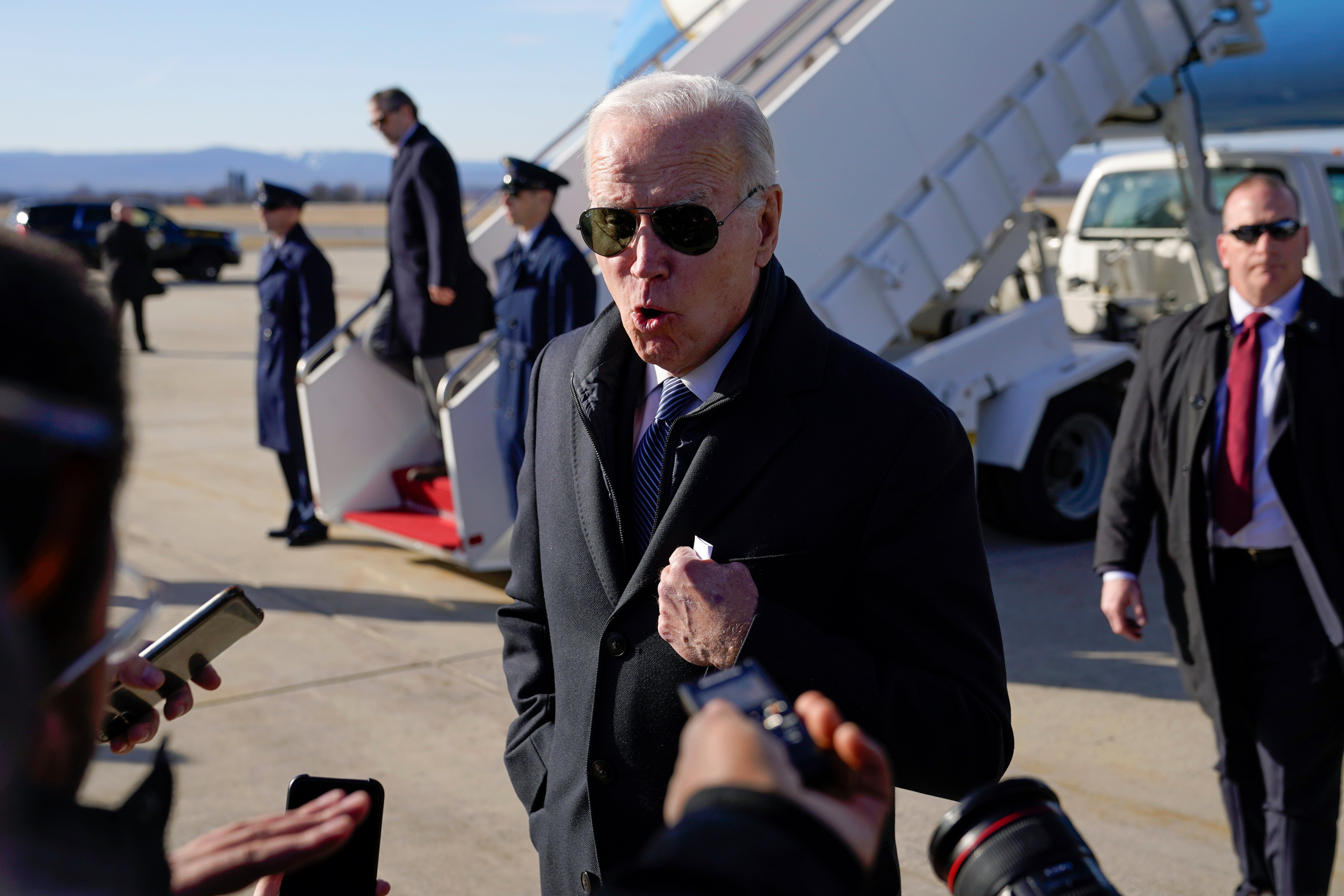 President Joe Biden speaks with members of the press on Saturday