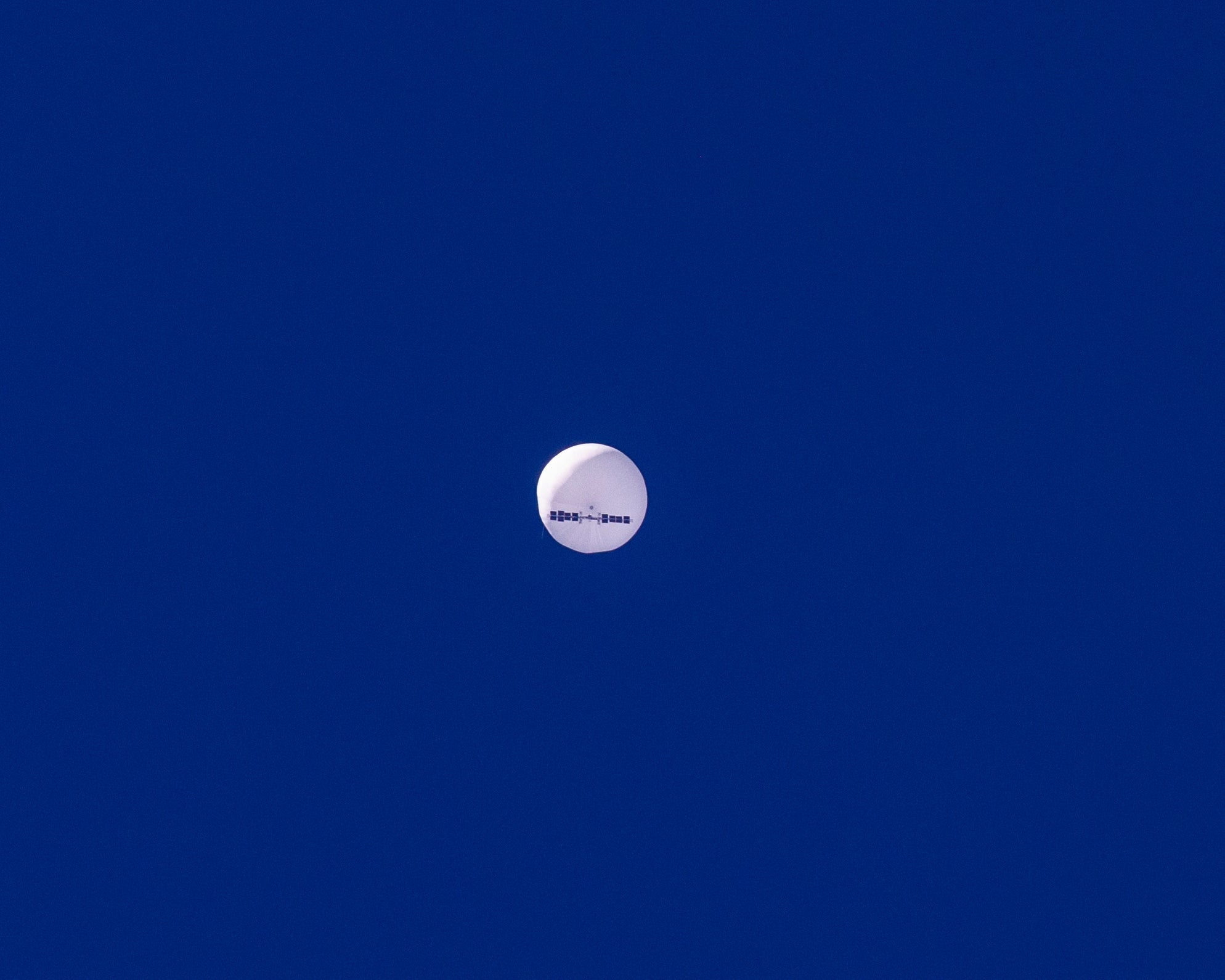 A large balloon drifts above the Atlantic Ocean, just off the coast of South Carolina, Saturday