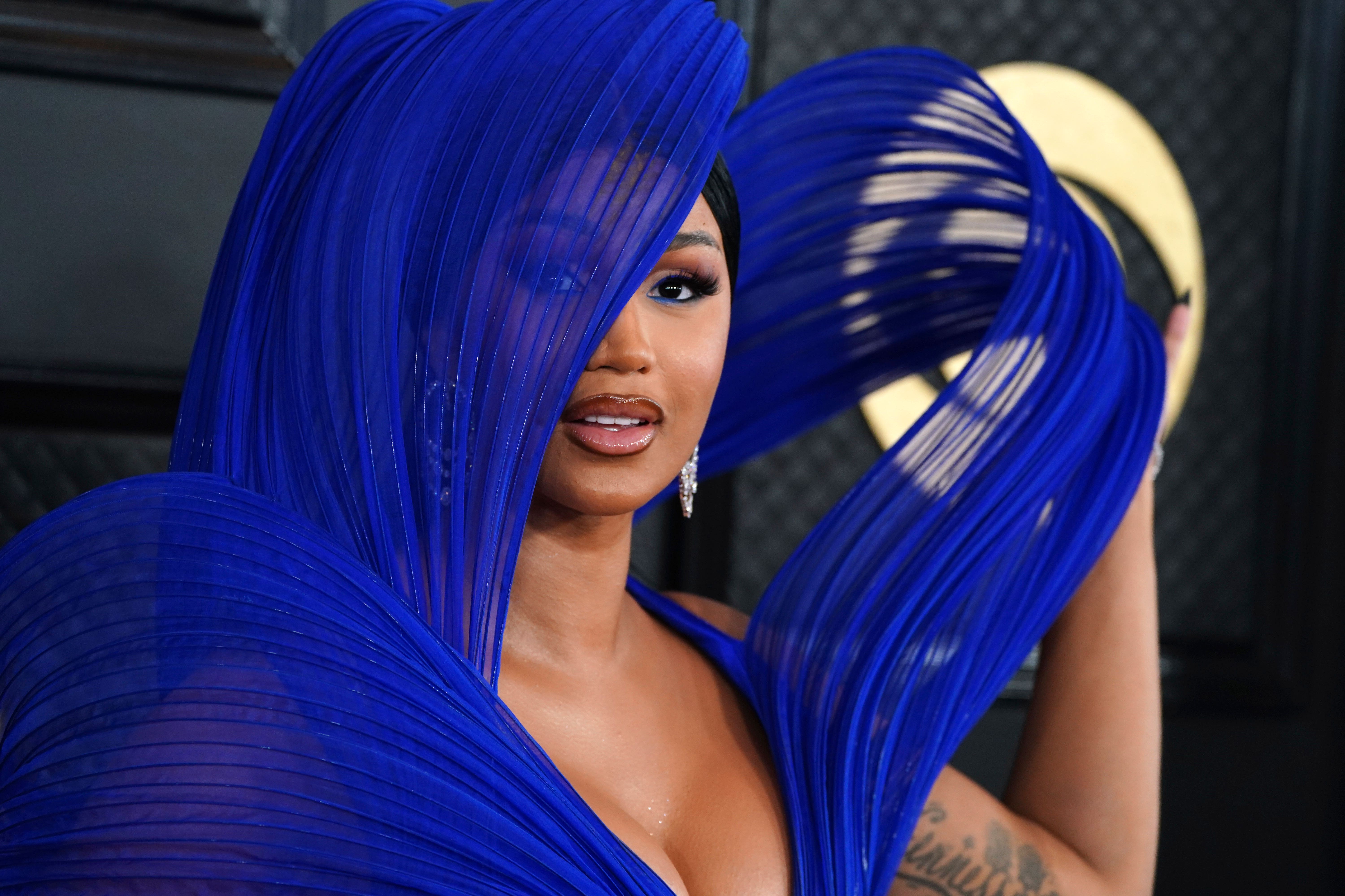 Cardi B arrives at the 65th annual Grammy Awards in cobalt blue (Jordan Strauss/AP)