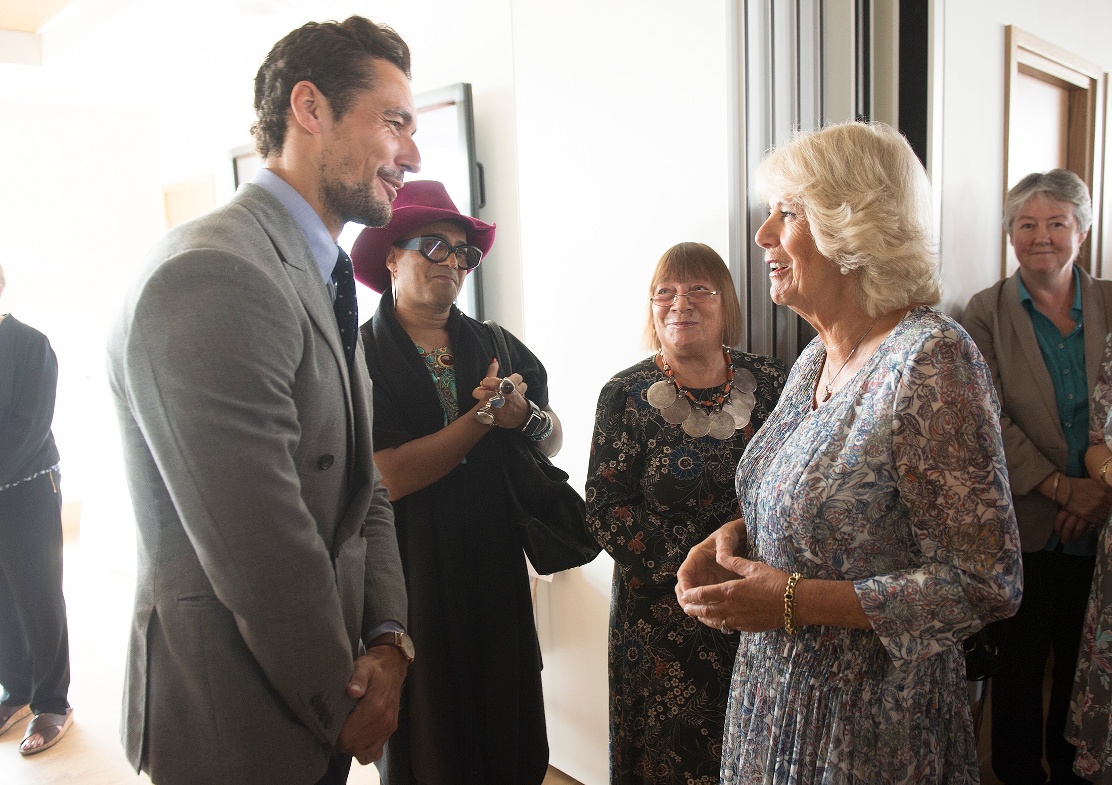 Alexander (second right) meeting the Queen Consort in 2016