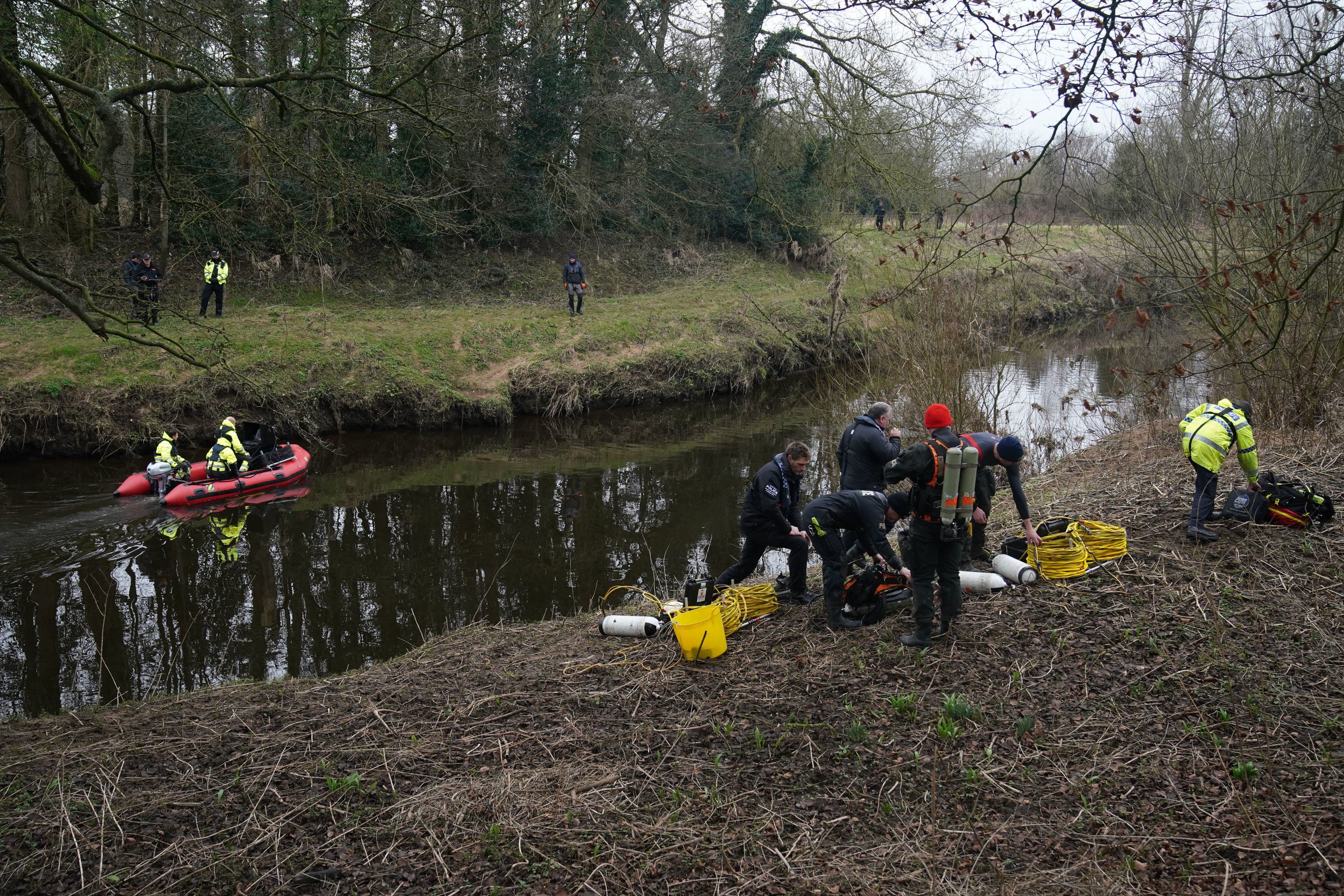 Police prepare to enter the river