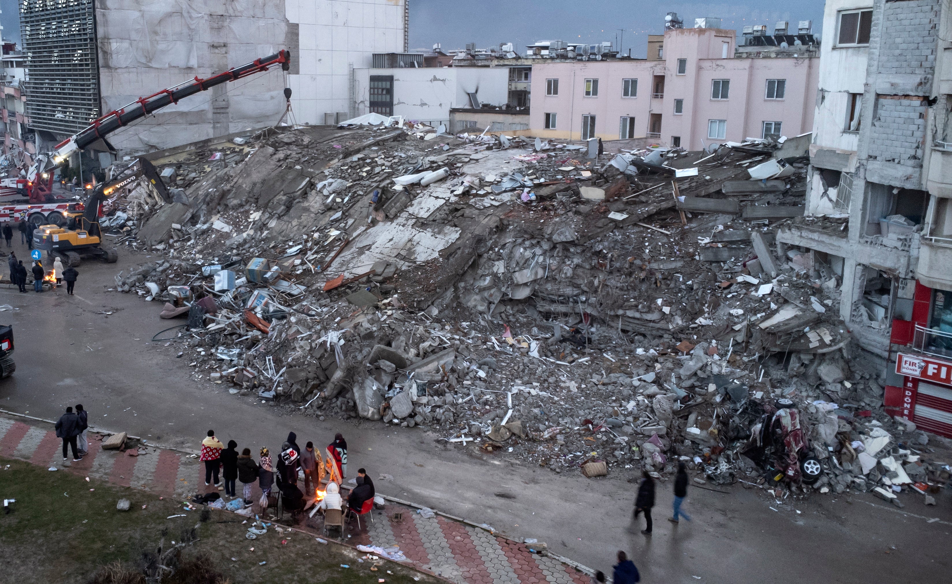 After: An aerial photo taken by a drone shows emergency personnel during a search and rescue operation at the site of a collapsed building after an earthquake in Iskenderun, district of Hatay, Turkey