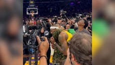 Lebron James hugs daughter after breaking NBA scoring record