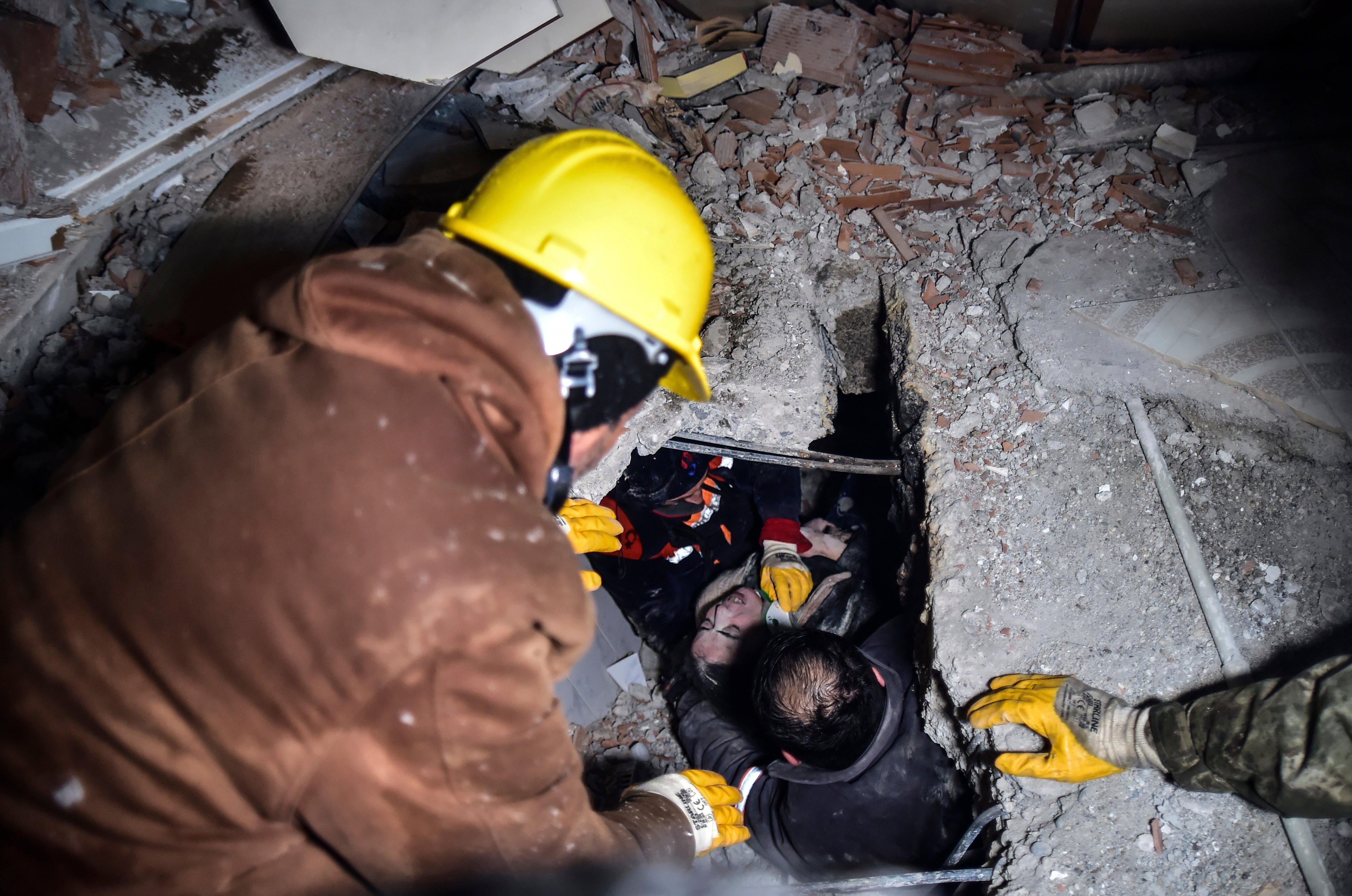 Emergency workers trying to rescue victims in Elbistan, Turkey