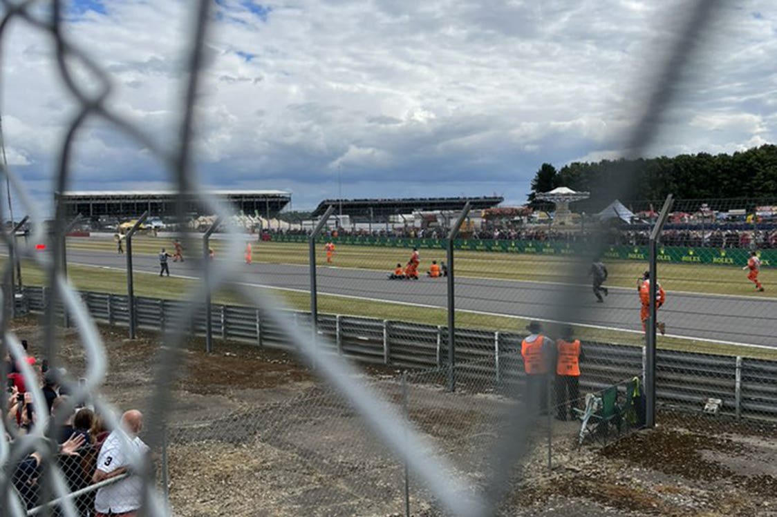 Protesters on the track during the British Grand Prix at Silverstone (Helena Hicks/PA)