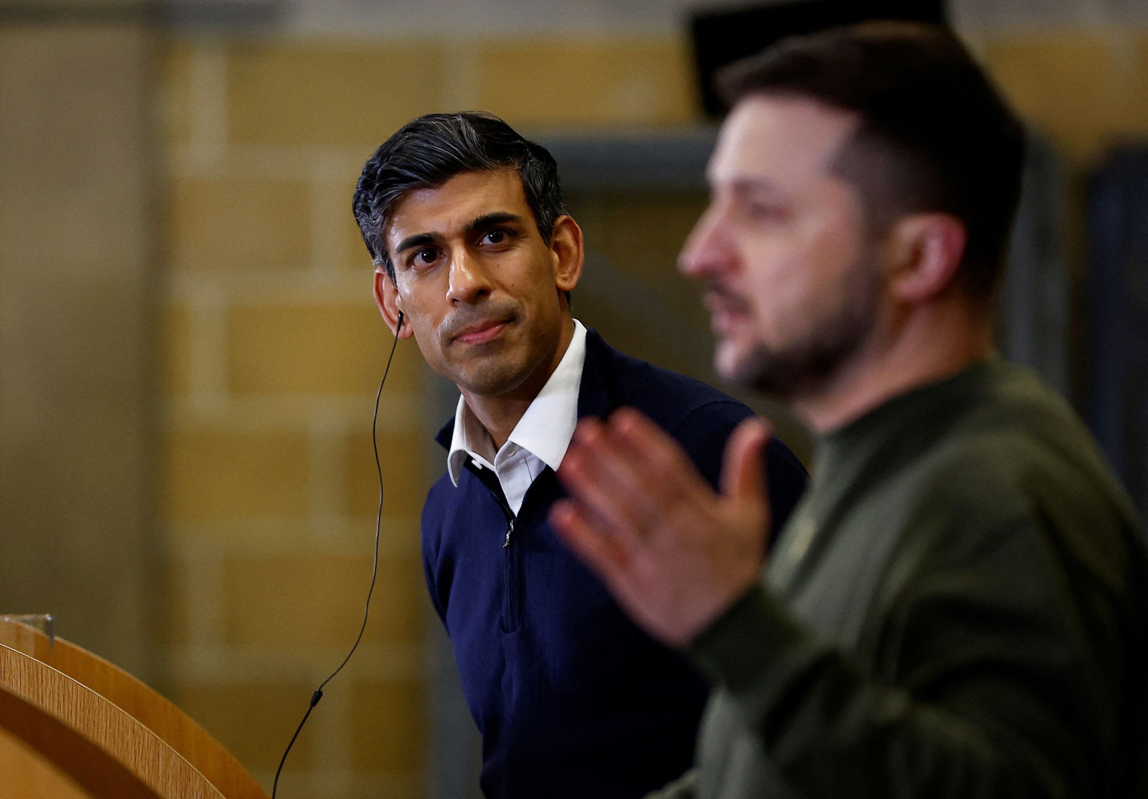 Prime minister Rishi Sunak listens to Volodymyr Zelensky speak at a press conference at an RAF training facility in Dorset