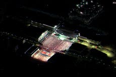 North Korea shows off unprecedented display of nuclear might in surprise night-time military parade