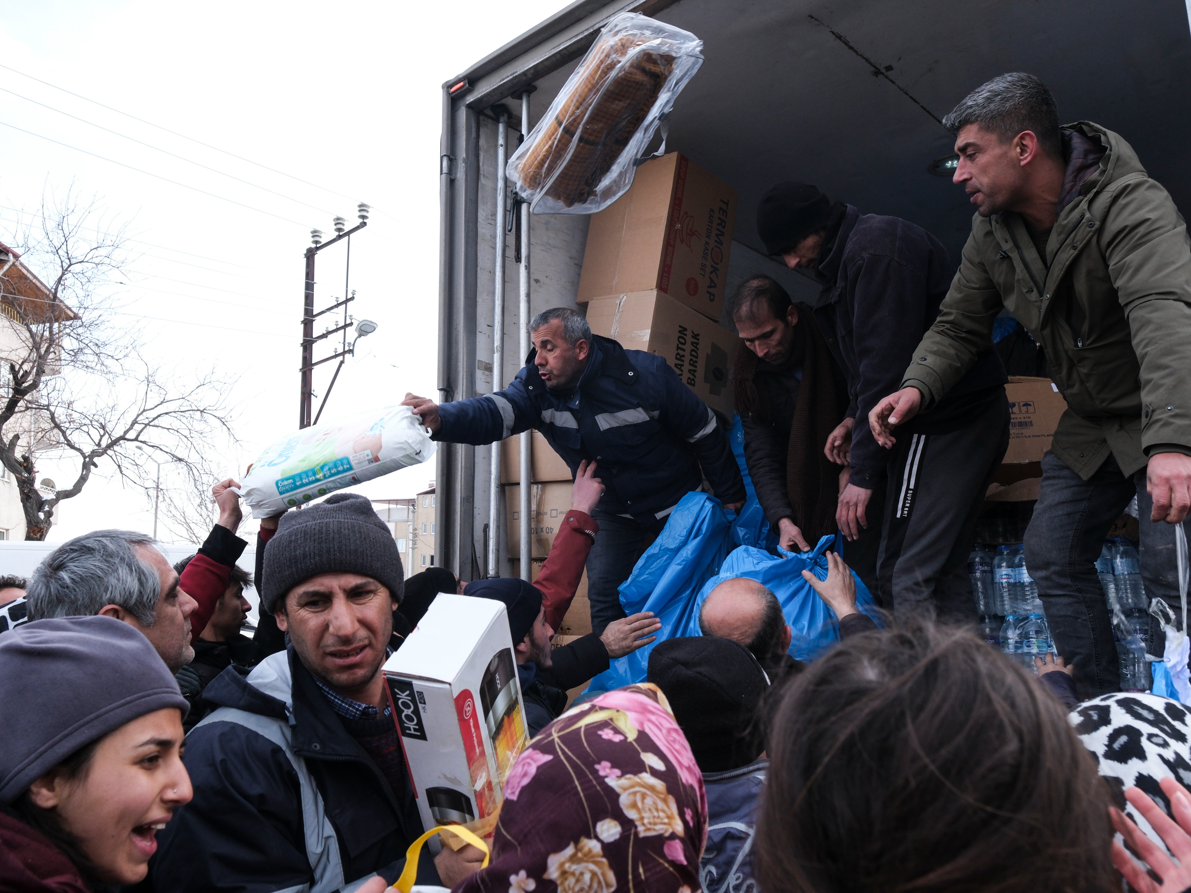 Volunteers deliver water, heaters, blankets and hygiene products to Turkish people