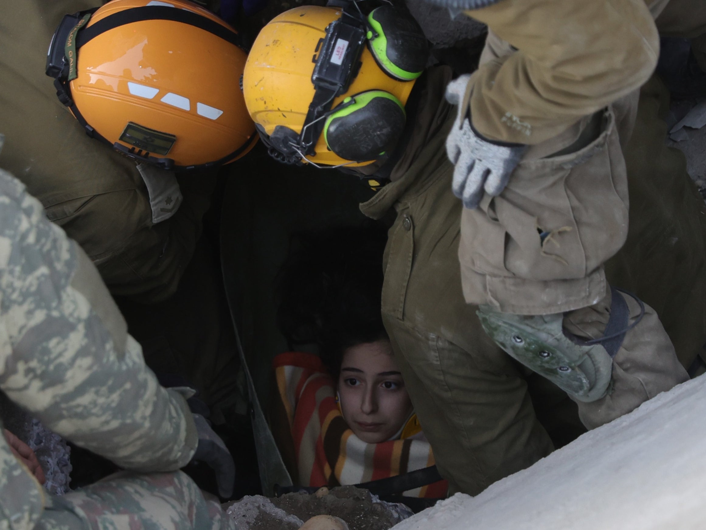 A teenage girl is pulled alive from rubble in Turkey