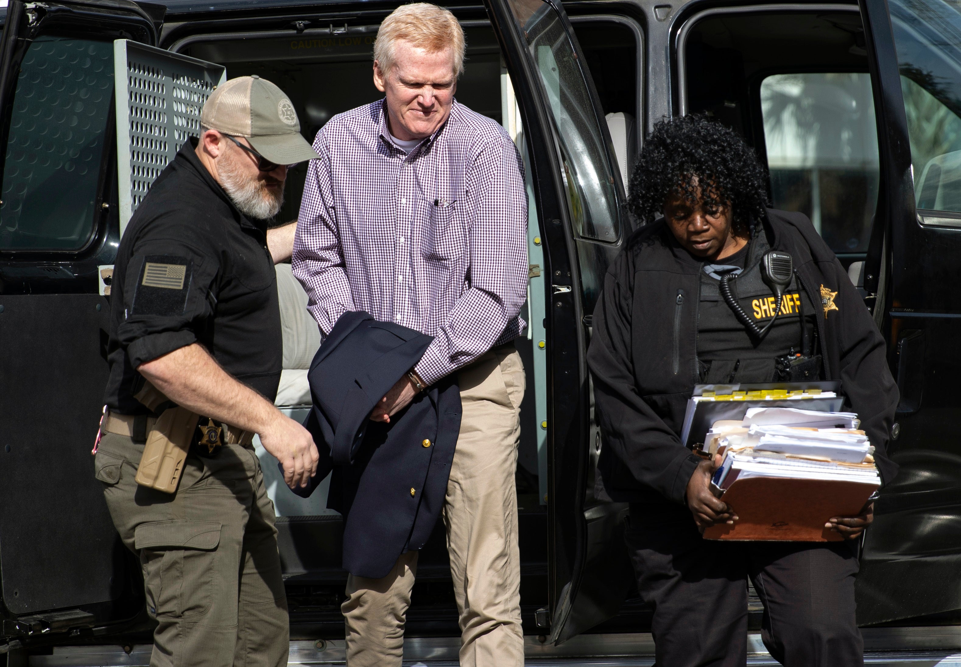 Alex Murdaugh is escorted back into the courtroom for his double murder trial at the Colleton County Courthouse on Wednesday