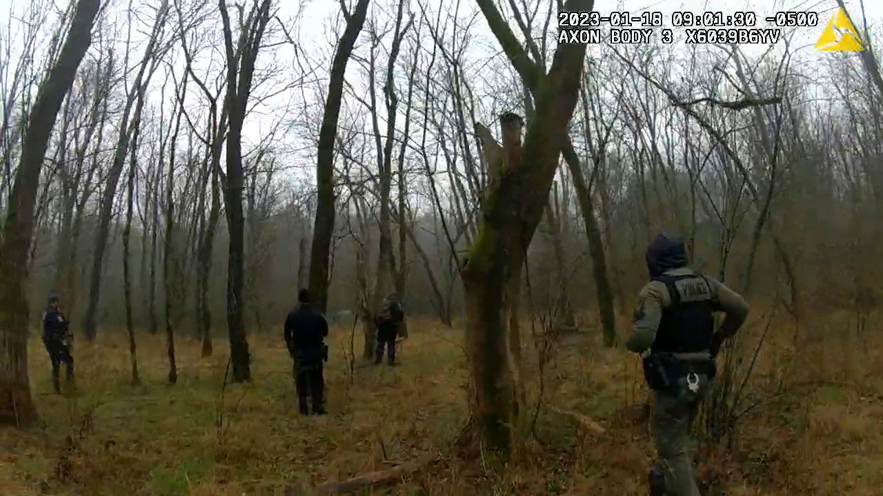 In this image taken from body cam video released by the Atlanta Police Department, officers respond to gunfire in the distance near the future site of City of Atlanta’s Public Safety Training Center