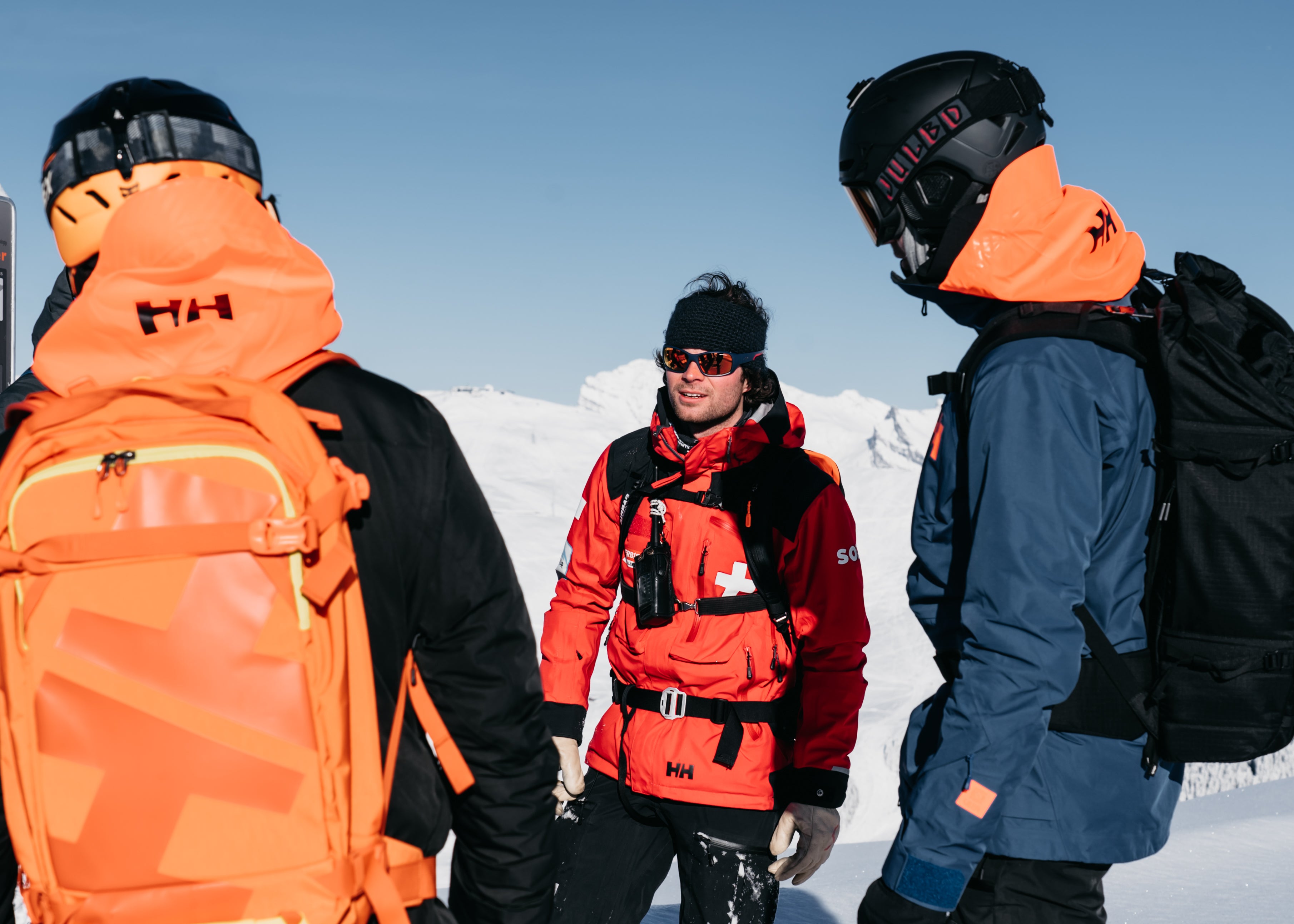 Ski patroller in Verbier giving safety tips to skiers