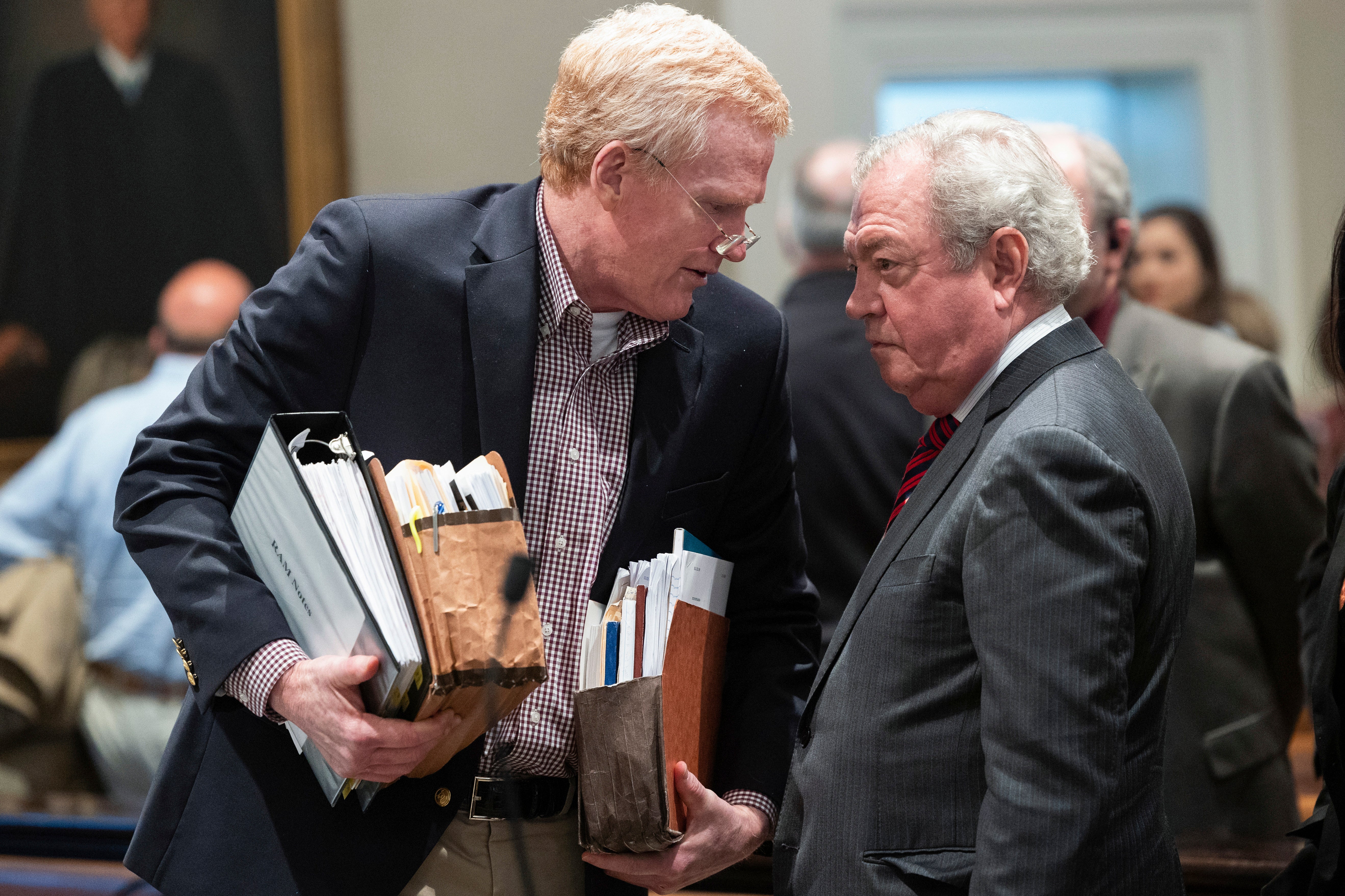 Alex Murdaugh speaks with his attorney Dick Harpootlian during his double murder trial