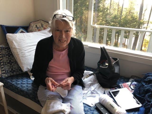 Karen Sturges works on baby jumpers at her home in Harpswell, Maine, in May 2021, a month before she passed away