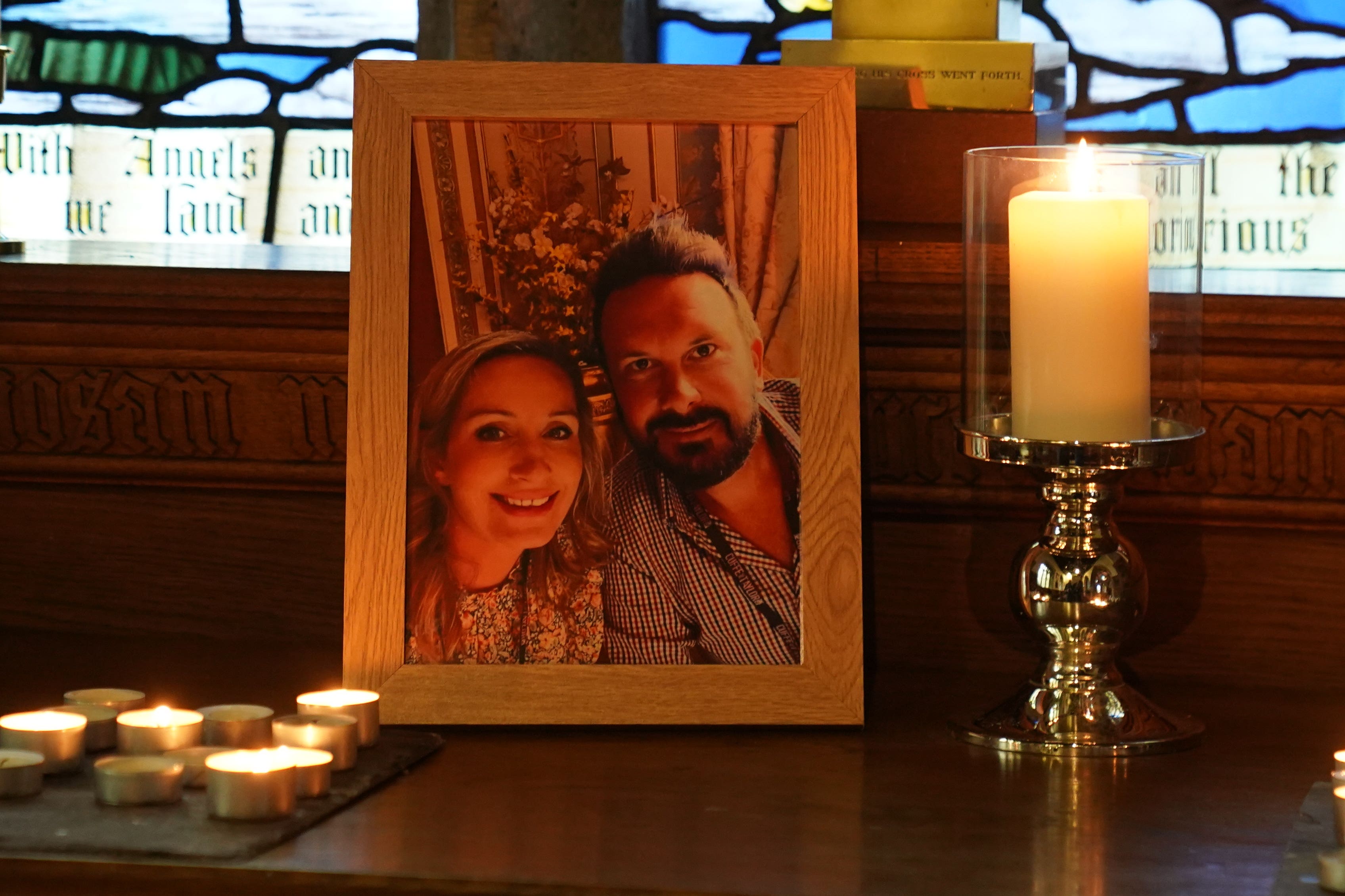 Candles are lit around a photo of Ms Bulley and Mr Ansell on an altar at St Michael’s Church in St Michael’s on Wyre, Lancashire