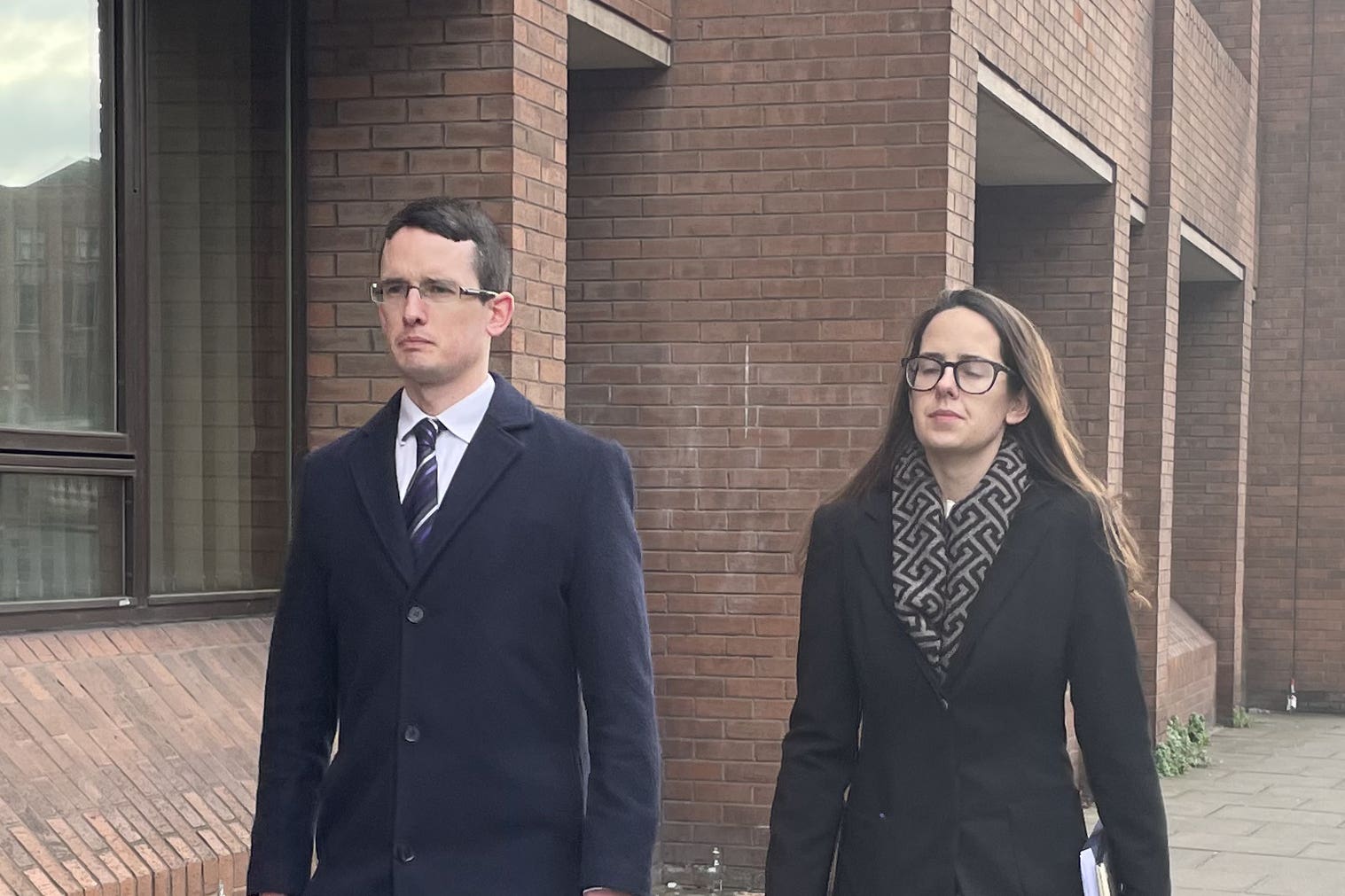 Irish teacher Enoch Burke and his sister Ammi leaving the High Court in Dublin (PA)