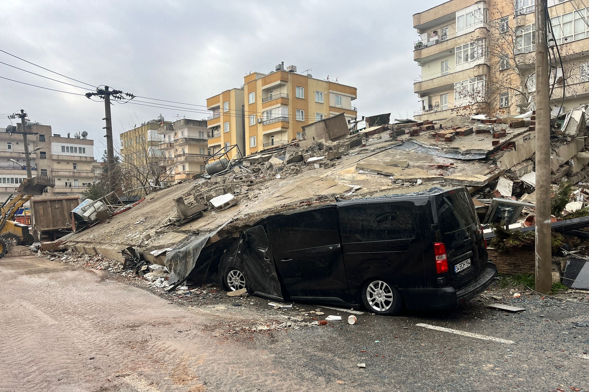 Handout photo taken with permission from the Twitter account @mehmetyetim63 of a van under a collapsed building in Sanliurfa, Turkey, after a 7.8 magnitude earthquake. At least 10 casualties have been reported and many more are feared dead after the earthquake knocked down multiple buildings in southeast Turkey and Syria. A UK team of search and rescue specialists is expected to arrive in Turkey by 11pm UK time, according to the Government. Issue date: Monday February 6, 2023.