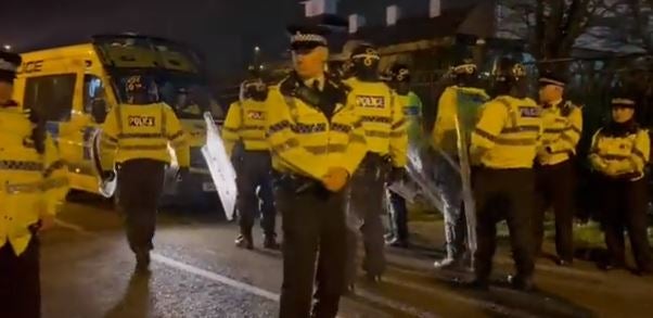 Riot police at the scene of the protests in Knowsley