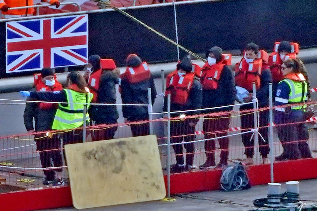 Refugees are brought to Dover, Kent, from a Border Force vessel following a small boat incident in the Channel