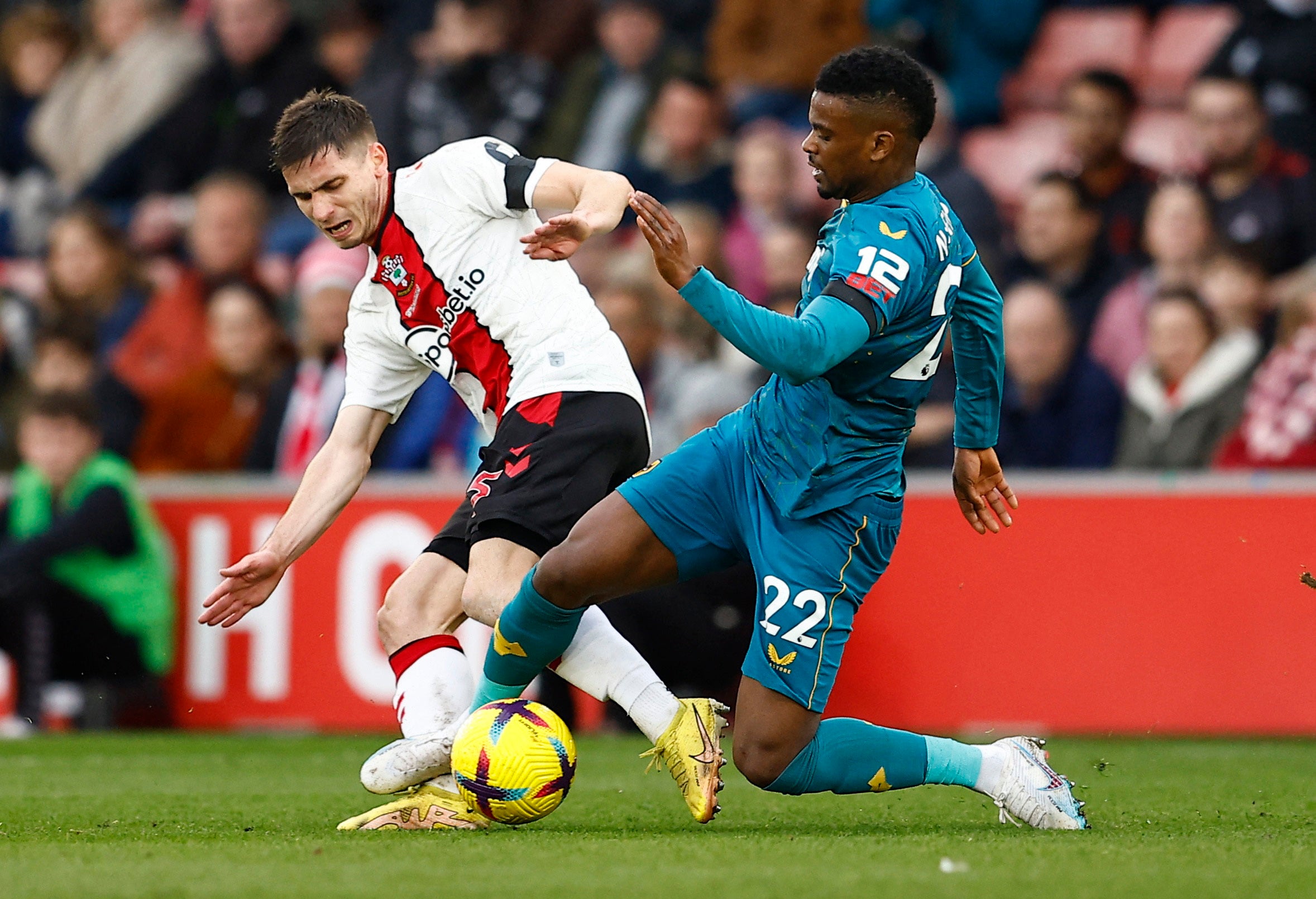 Wolves’ Nelson Semedo, right, fouls Southampton’s Romain Perraud