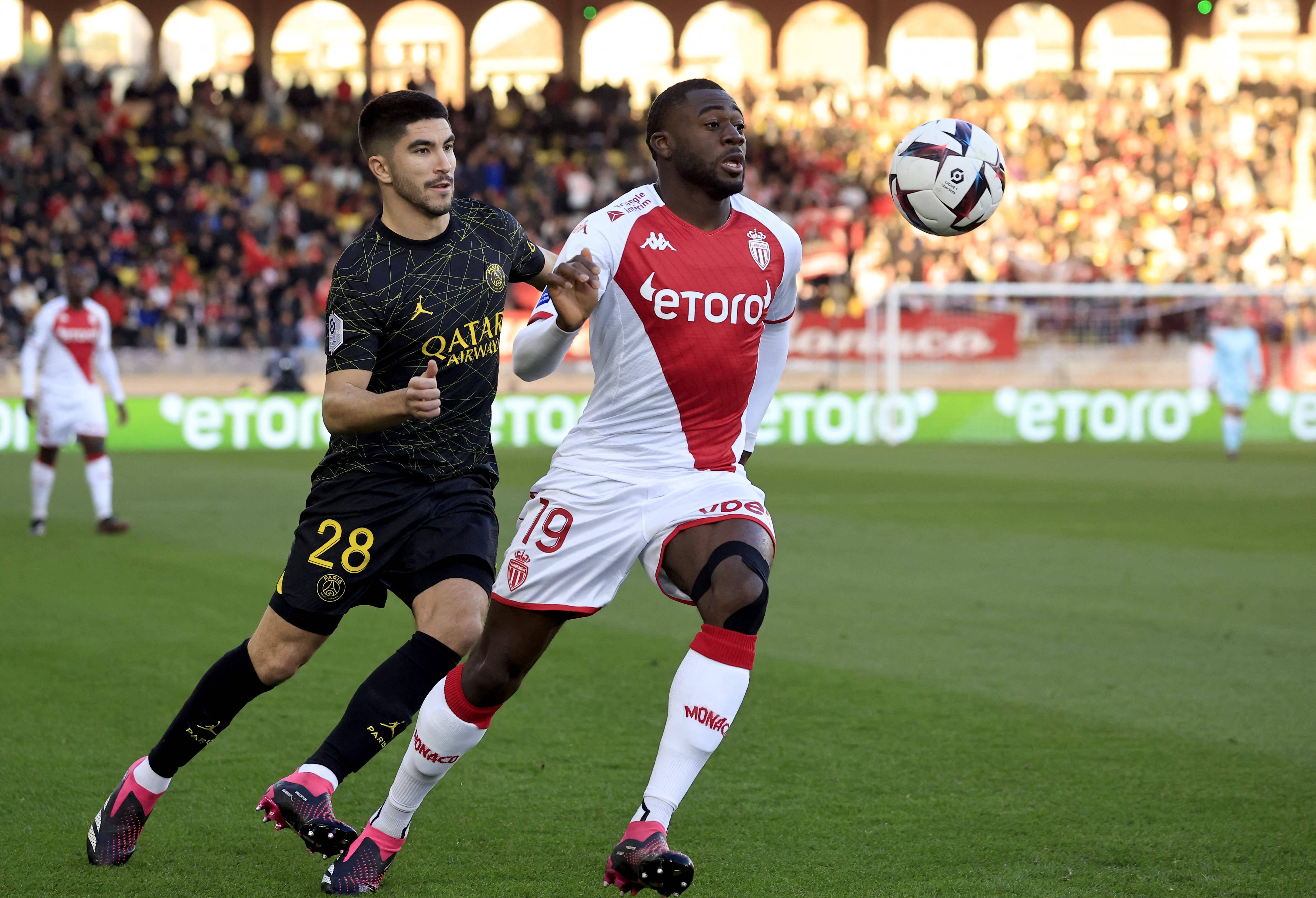 Monaco's French midfielder Youssouf Fofana (R) vies with Paris Saint-Germain's Spanish midfielder Carlos Soler