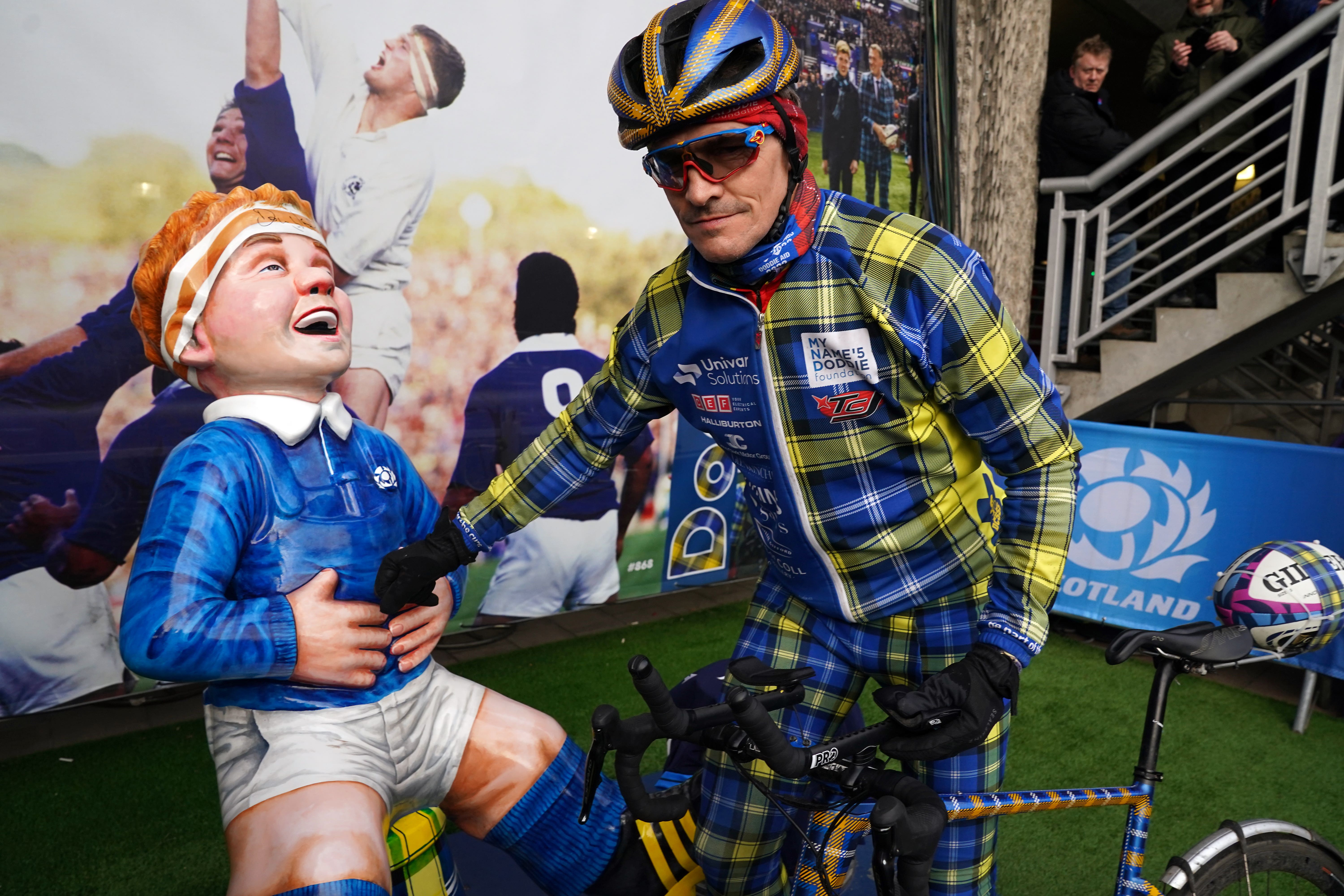 Former Scotland captain Rob Wainwright arrives with the match ball after a team of rugby legends cycled 555 miles in 48 hours in a fundraising event for research into motor neurone disease ahead of the Guinness Six Nations match at BT Murrayfield, Edinburgh (Andrew Milligan/PA)