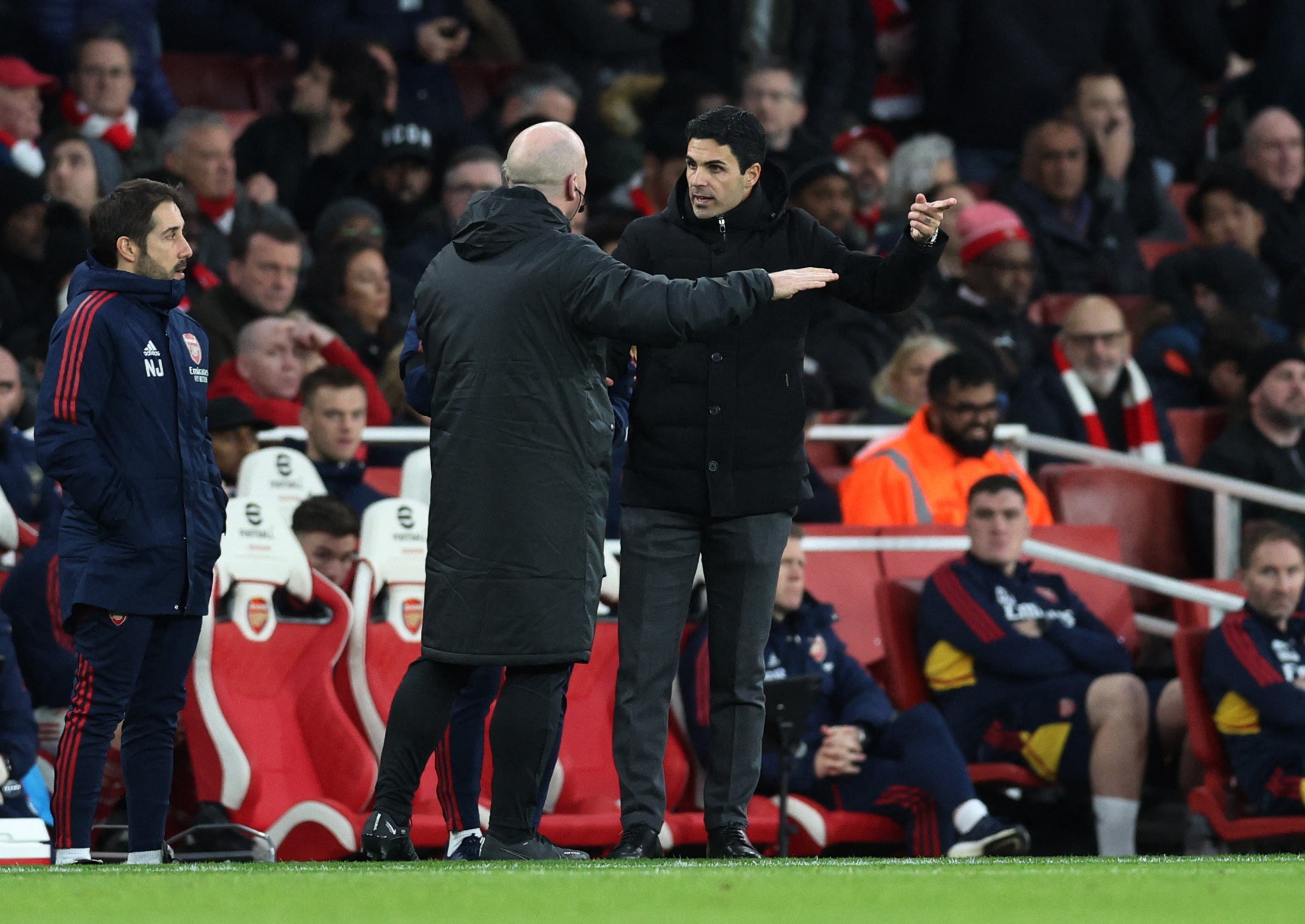 Arsenal coach Mikel Arteta (right) remonstrates with the fourth official