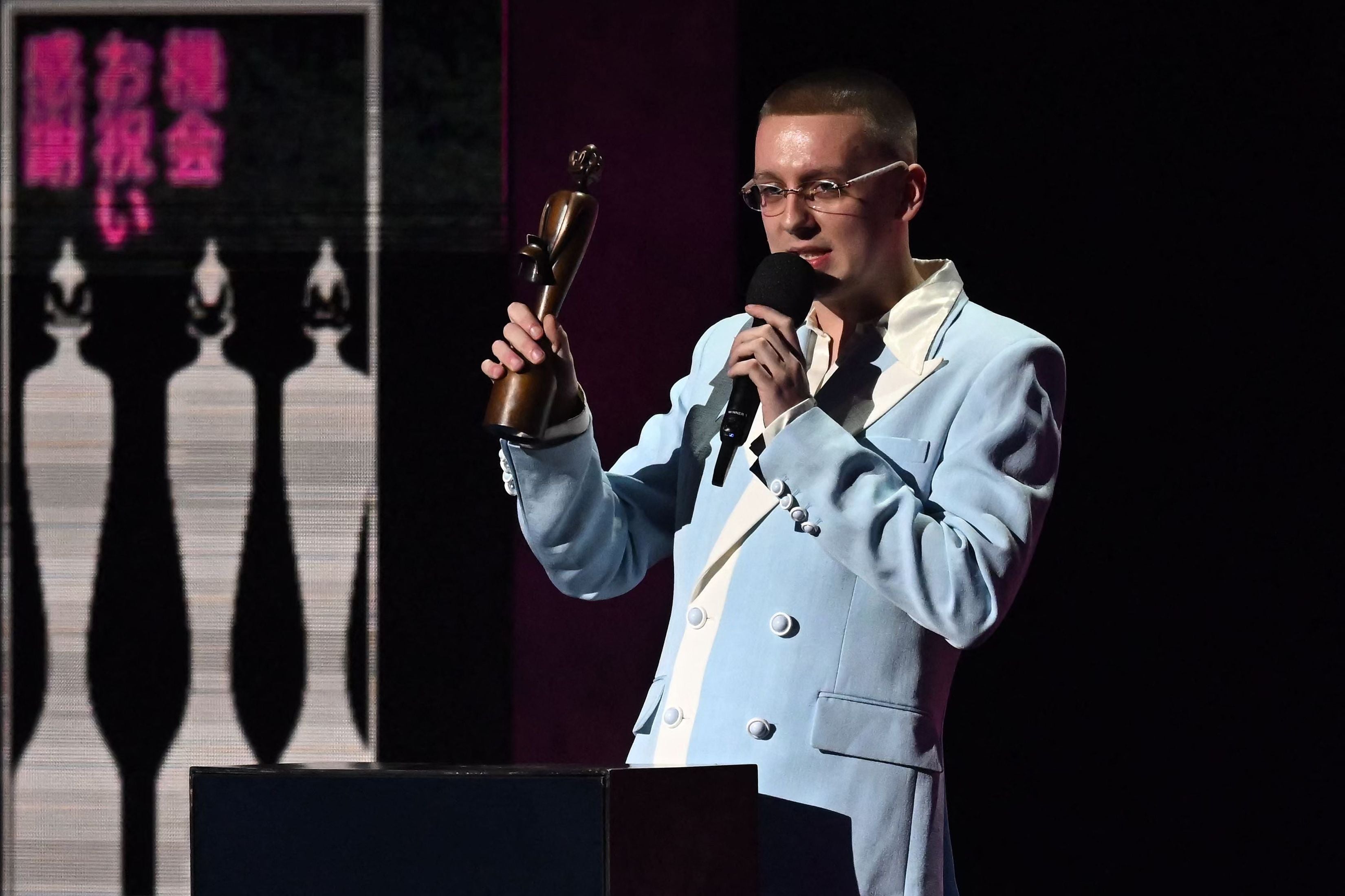 British rapper Aitch celebrates after receiving the best hip hop, grim and rap act of the year award