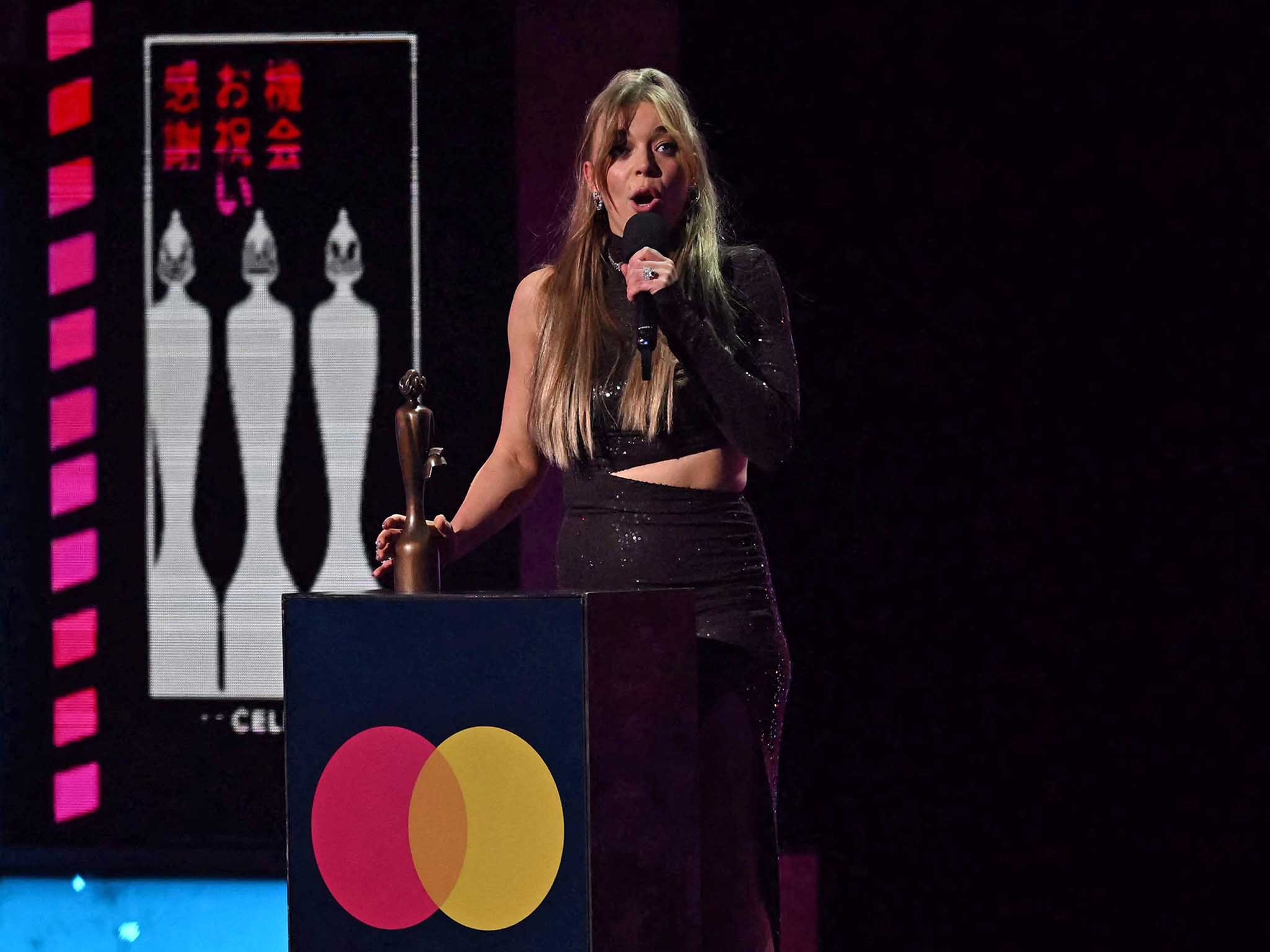 British singer Becky Hill celebrates after receiving the best dance act of the year award during BRIT Awards 2023