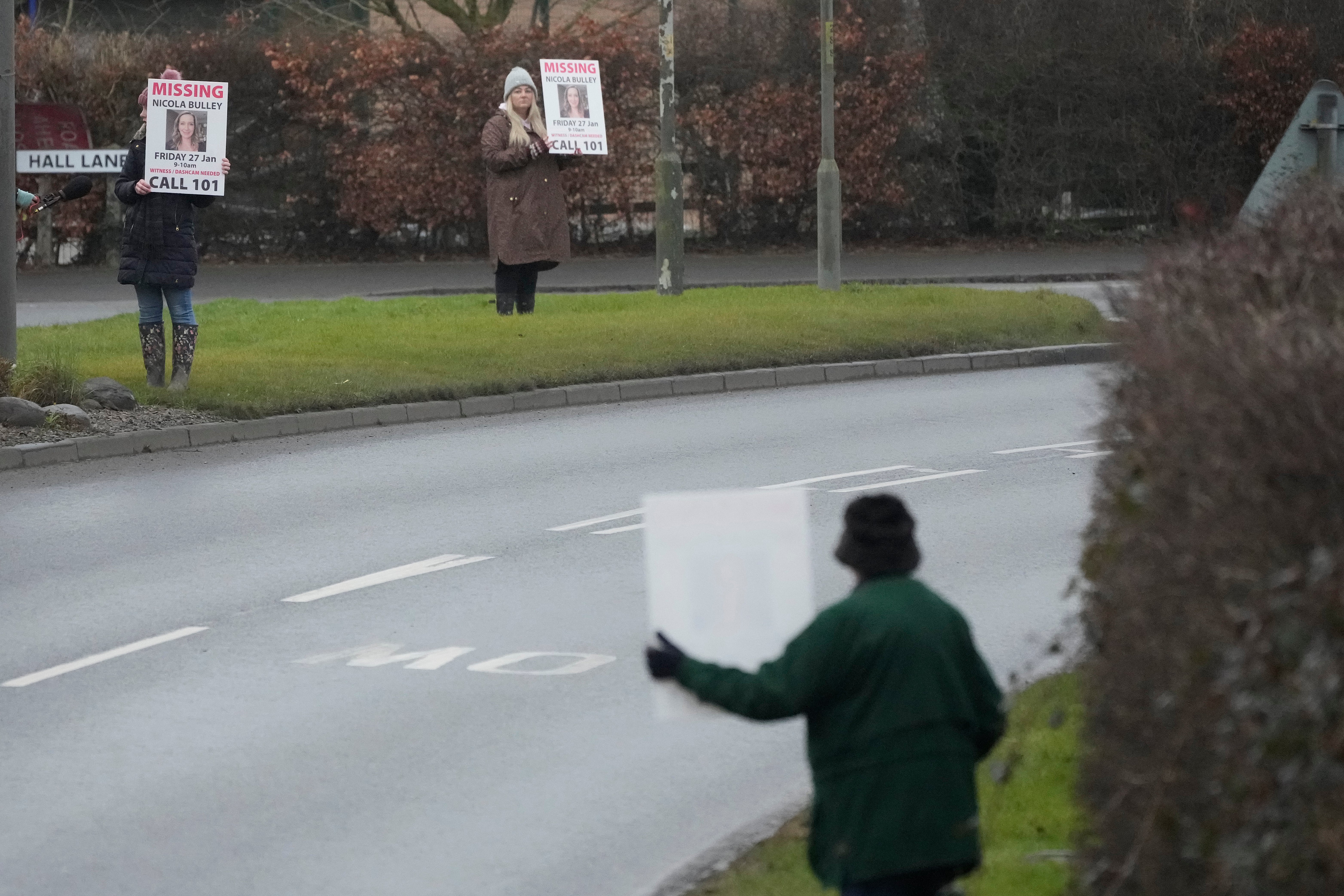 People line the streets of St Michael’s on Wyre with placards asking for information on Bulley