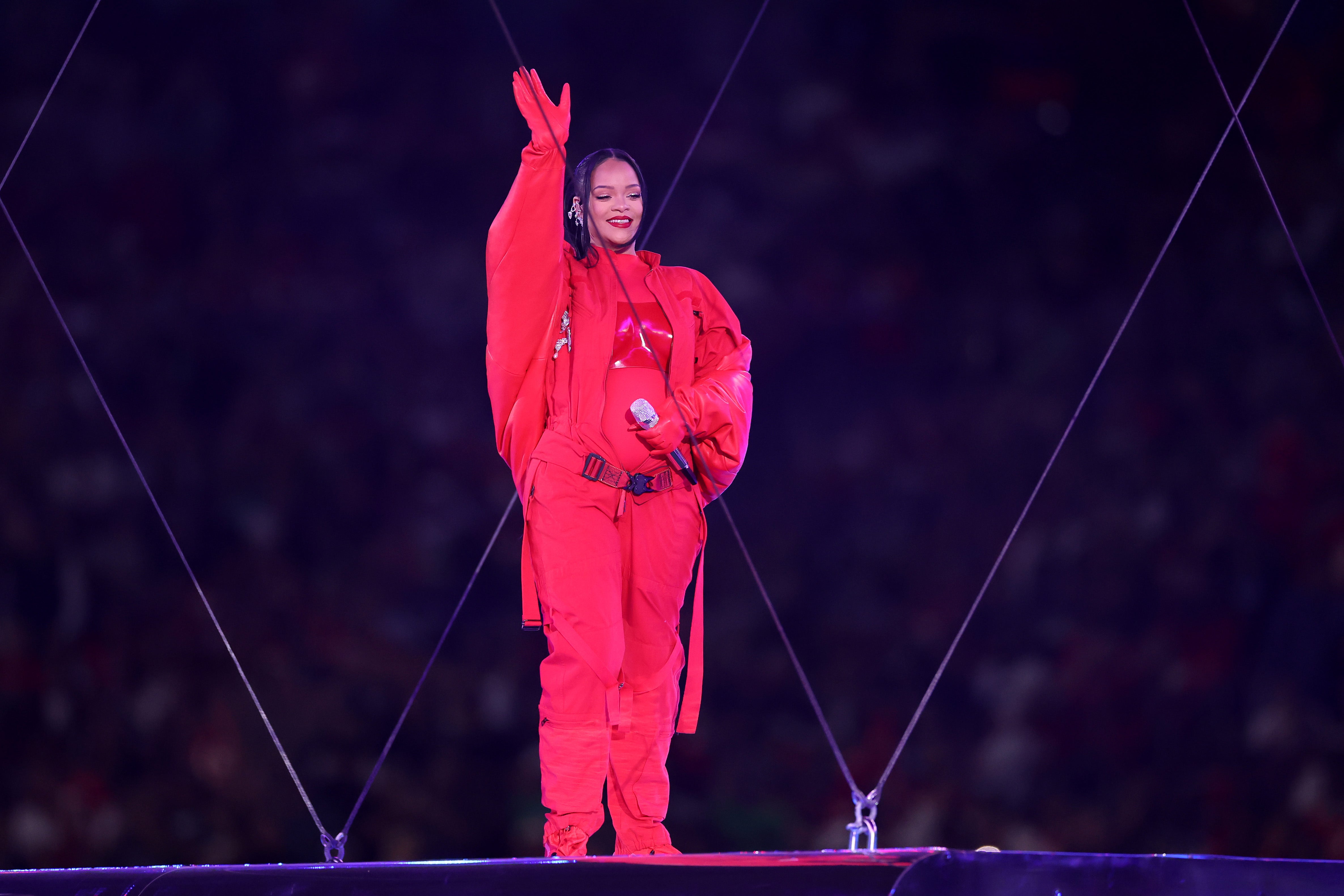 Rihanna sports a custom red jumpsuit designed by Loewe