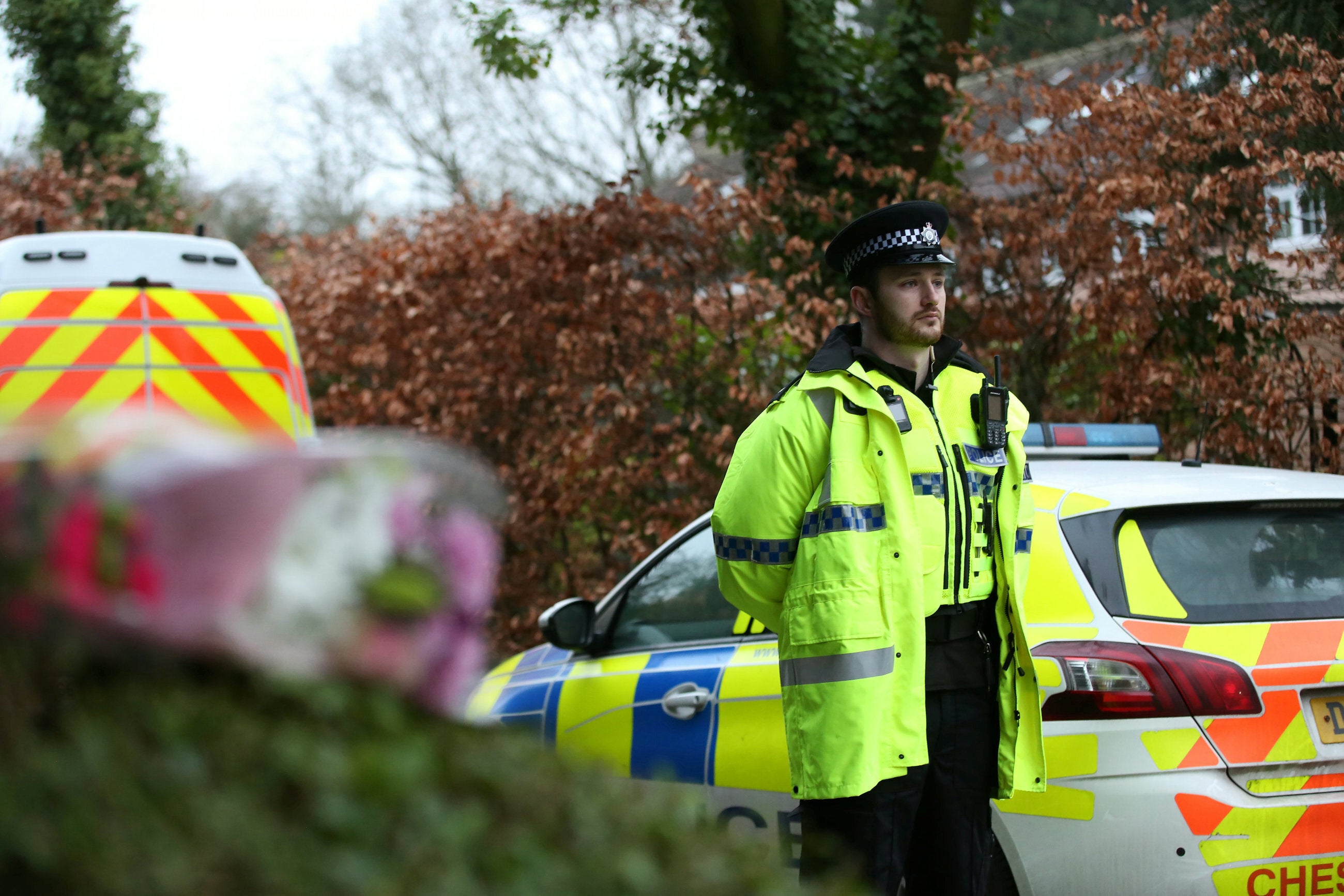 An officer near the scene at Linear Park in Culcheth, Warrington