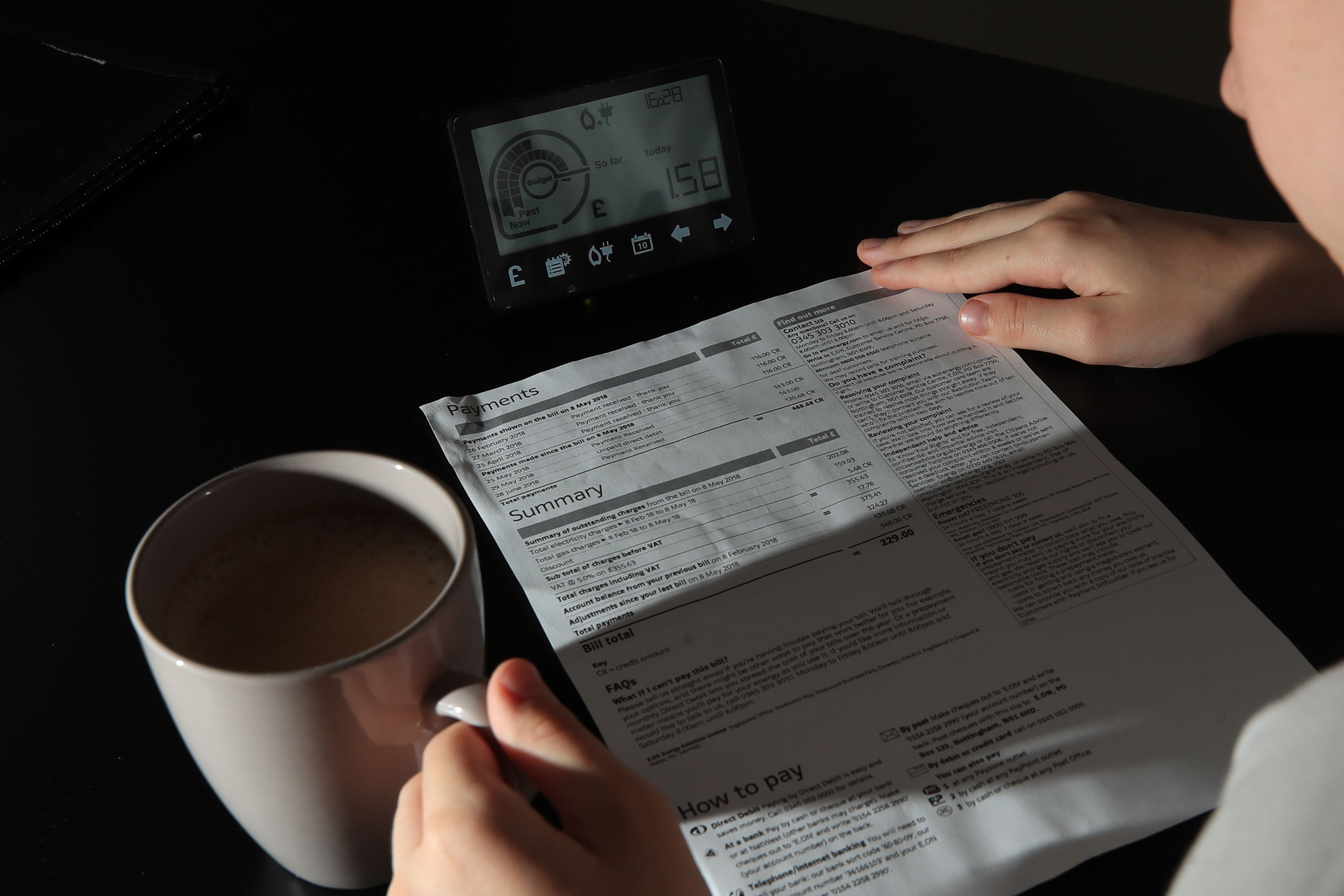 A smart meter next to an energy bill (Peter Byrne/PA)