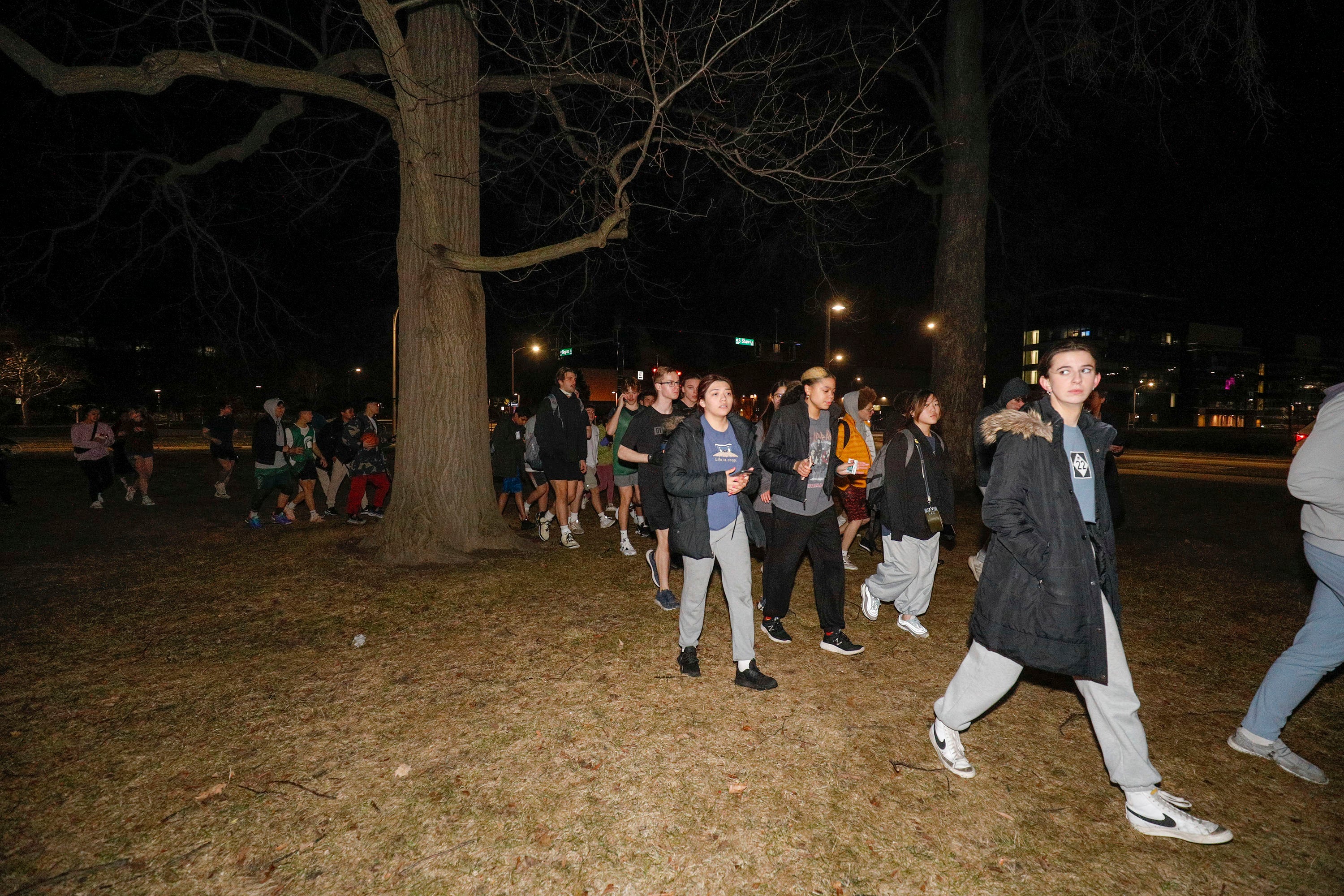 Michigan State University students evacuate to a safe area during an active shooter situation on campus on 13 February 2023 in Lansing, Michigan