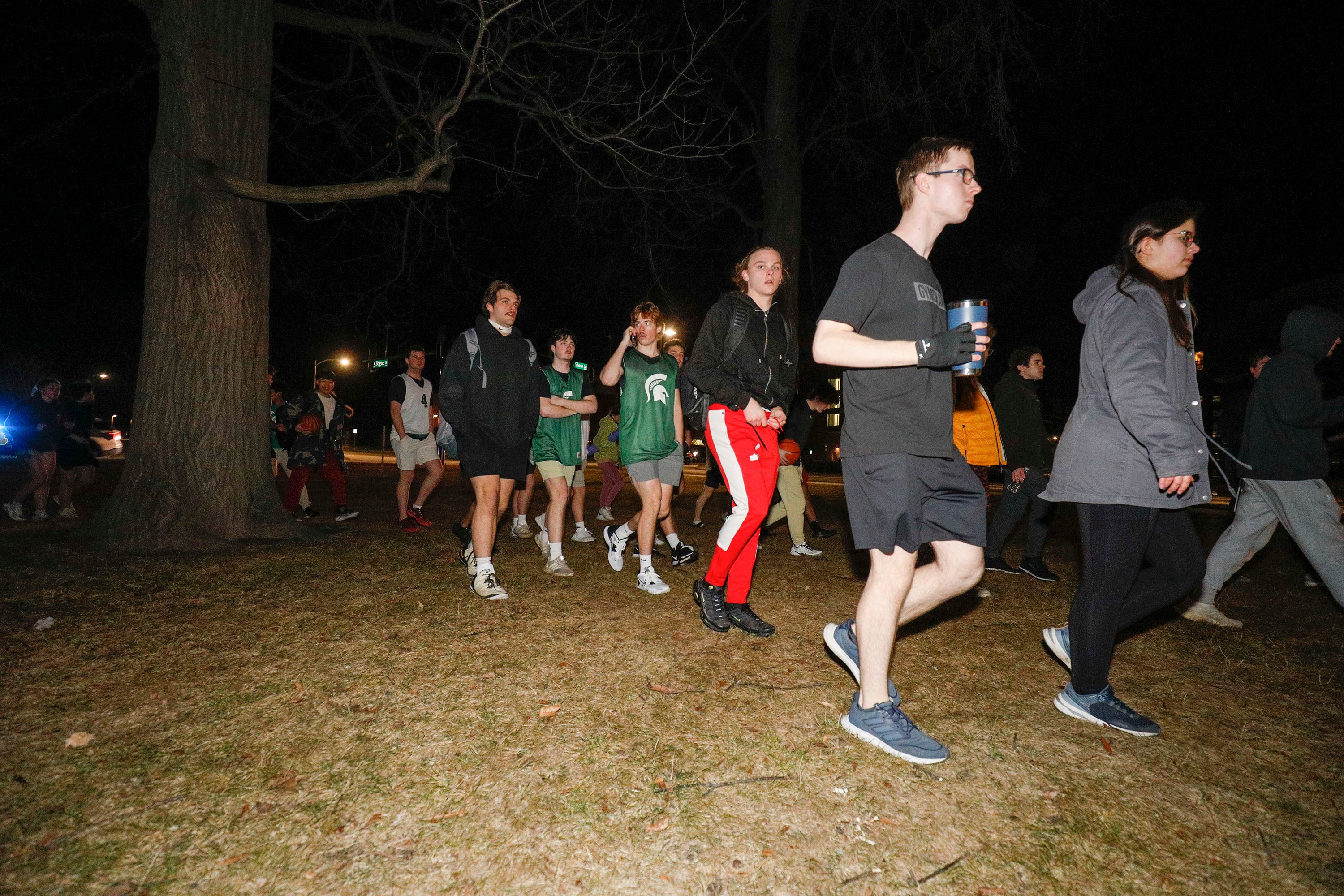 Michigan State University students evacuate to a safe area during an active shooter situation on campus on 13 February 2023 in Lansing, Michigan