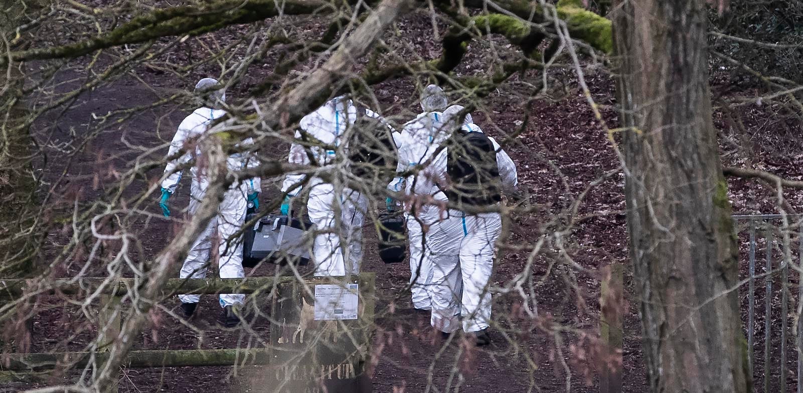 Police forensics officers at the scene in Culcheth Linear Park in Warrington, Cheshire