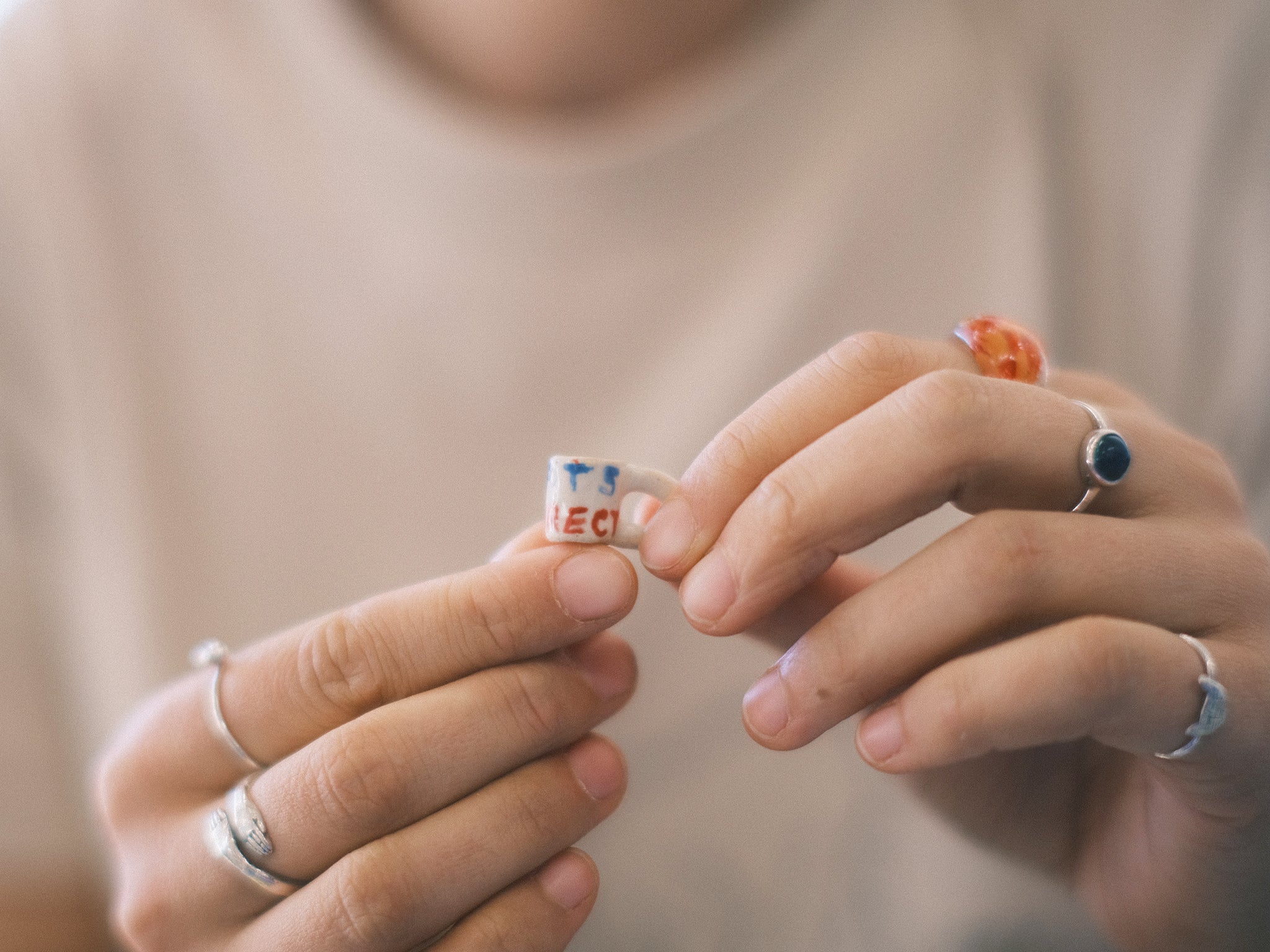 Artist Veronika McQuade with one of her tiny ‘Sports Indirect’ miniatures