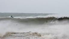 Cyclone Gabrielle: Surfers brave torrential waves in New Zealand