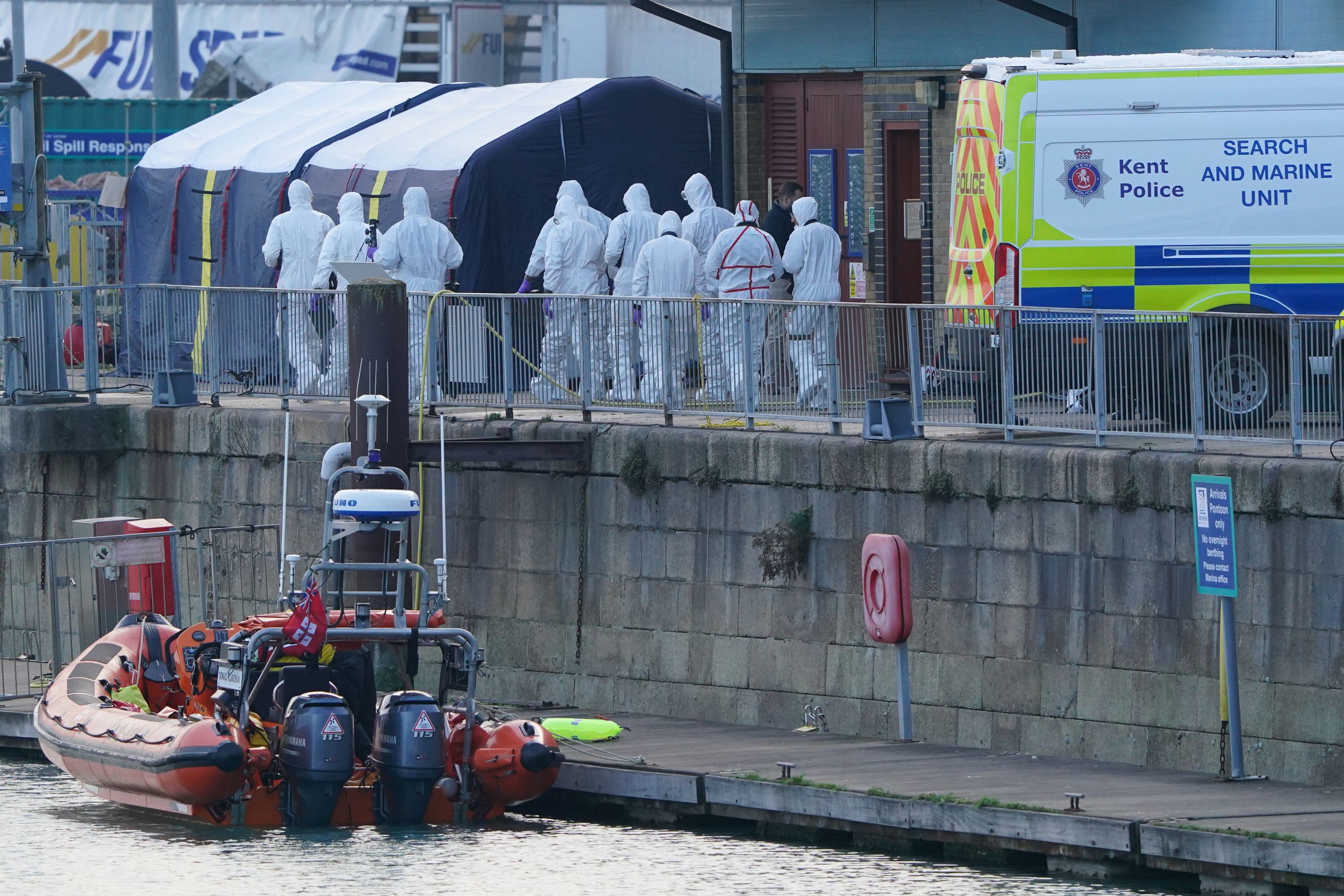 Police forensic officers at the RNLI station at the Port of Dover following the disaster on 14 November last year