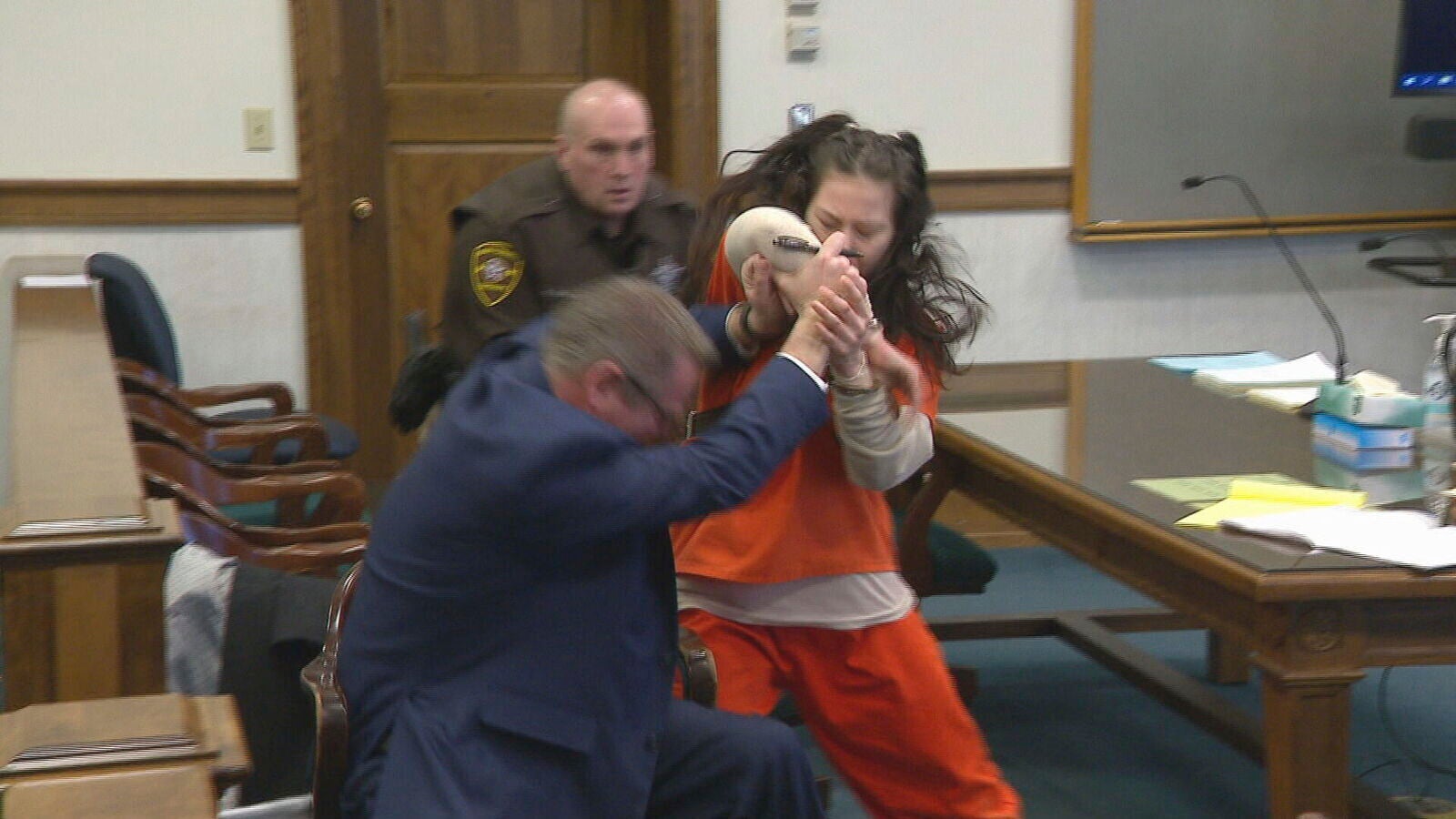 Taylor Schabusiness attacks her attorney, Quinn Jolly, in Brown County court in Green Bay, Wis., on Tuesday, Feb. 14, 2023