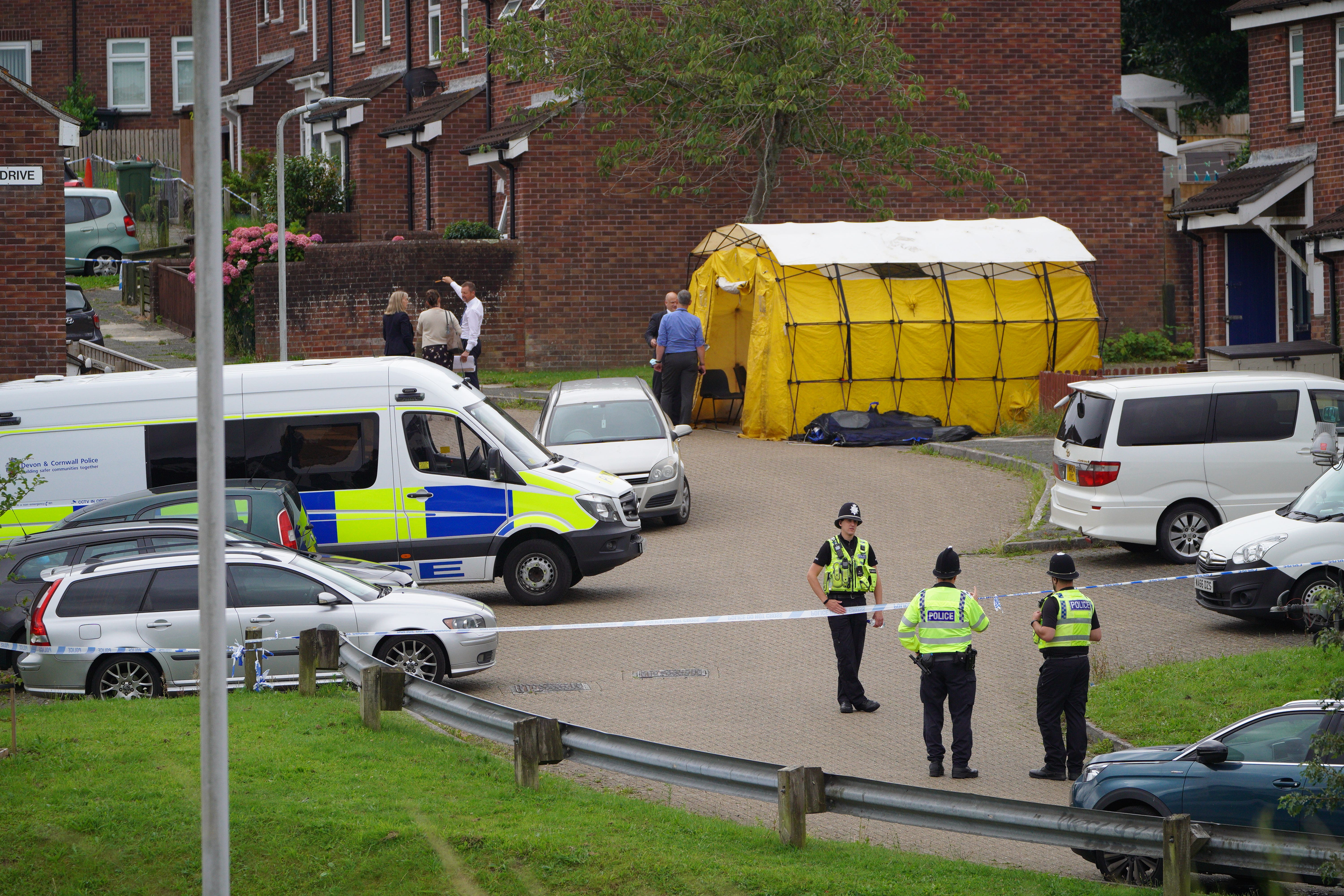 Police in Biddick Drive, Plymouth, following the shootings (Ben Birchall/PA)