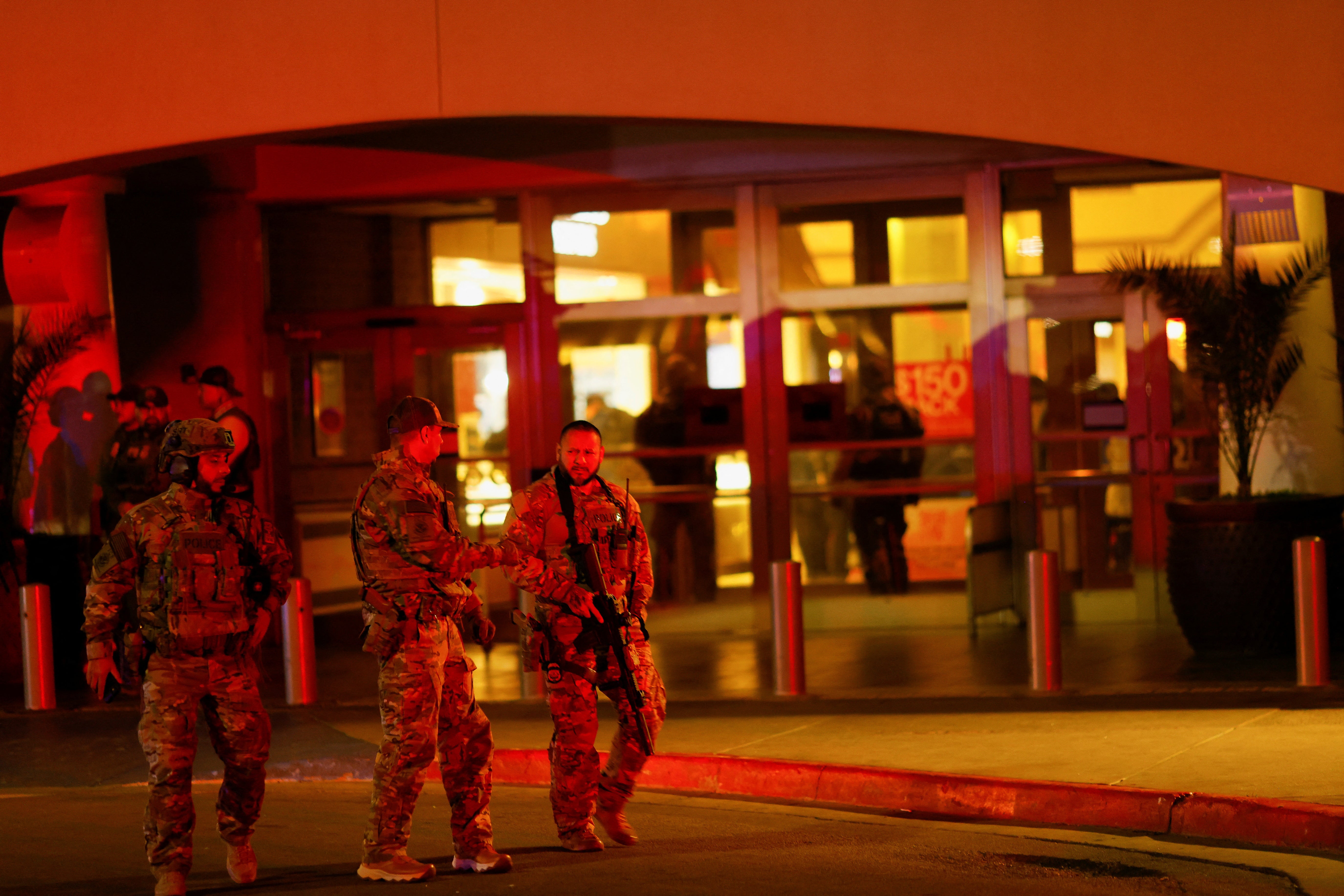 Law enforcement members are seen outside the Cielo Vista Mall after the shooting