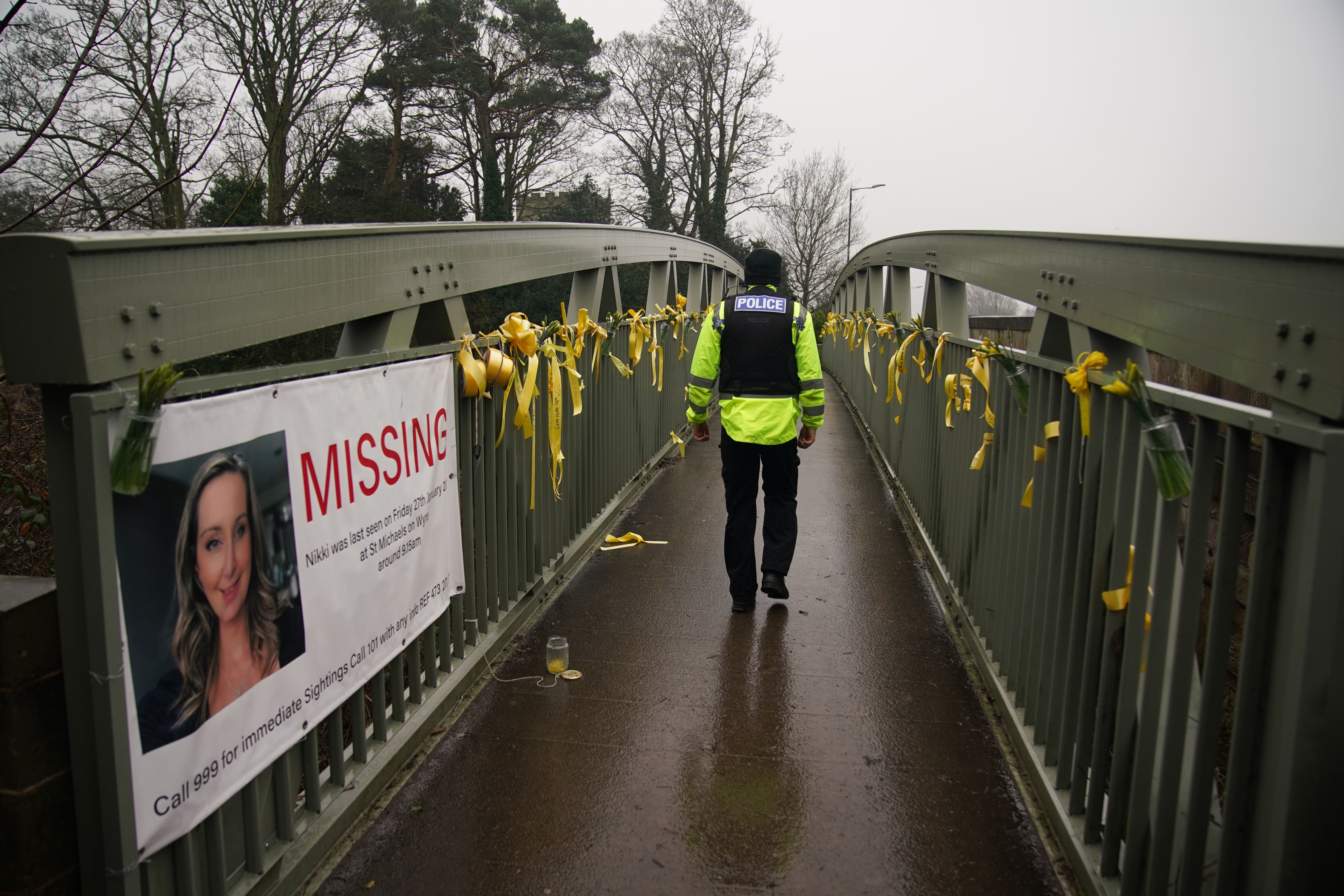 Yellow ribbons and messages of hope tied to a bridge over the River Wyre in St Michael’s on Wyre, Lancashire, near where the mother of two vanished