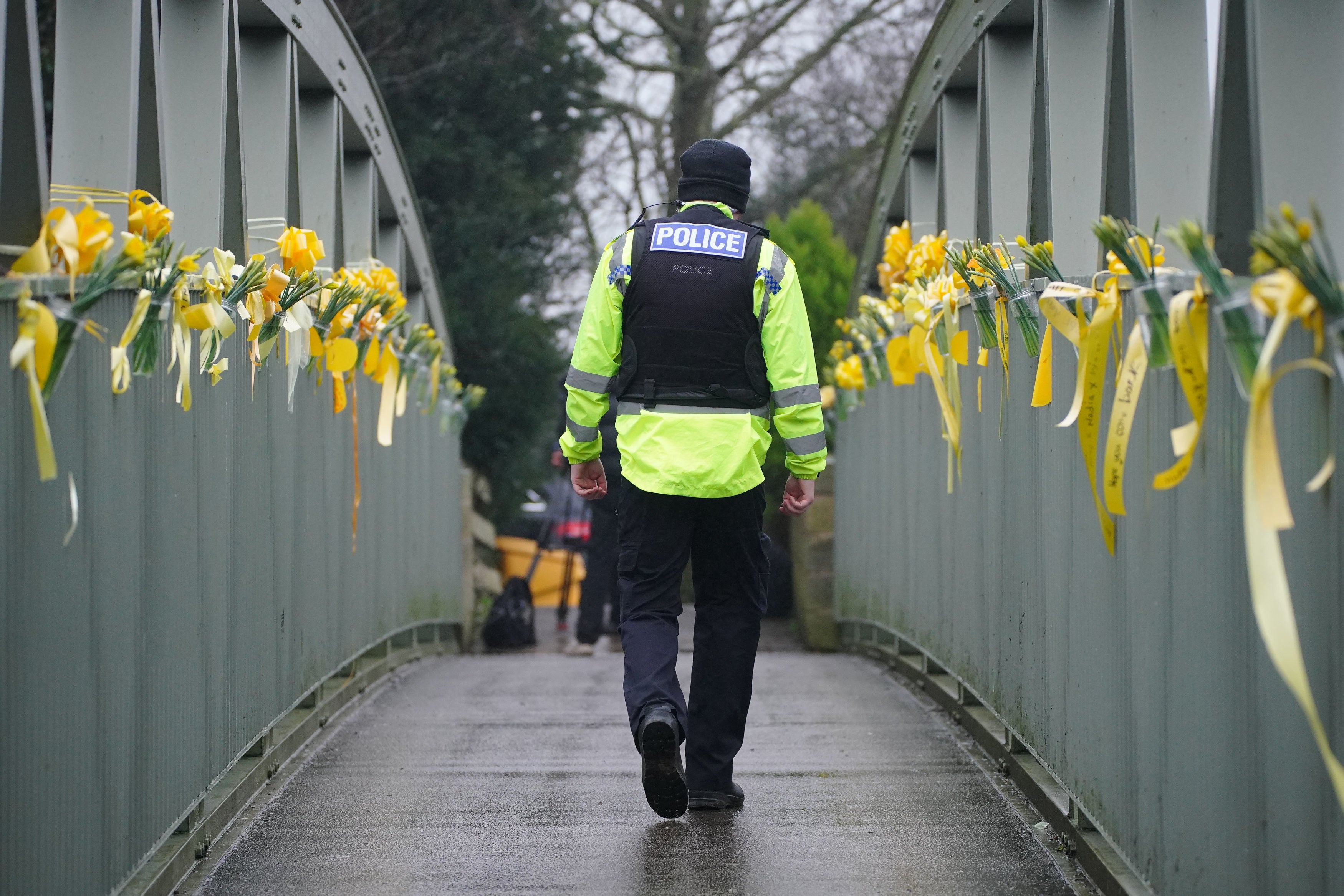 Friends and family leave ribbons with messages to Nicola Bulley on a bridge where she was last seen