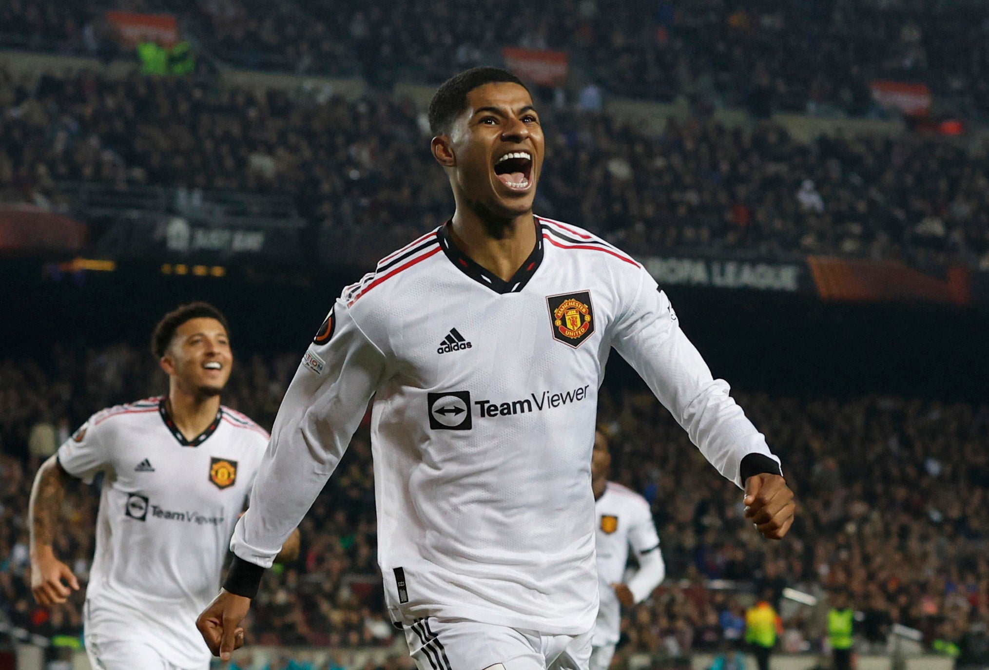 Rashford celebrates after Kounde scores an own goal and the second for Manchester United